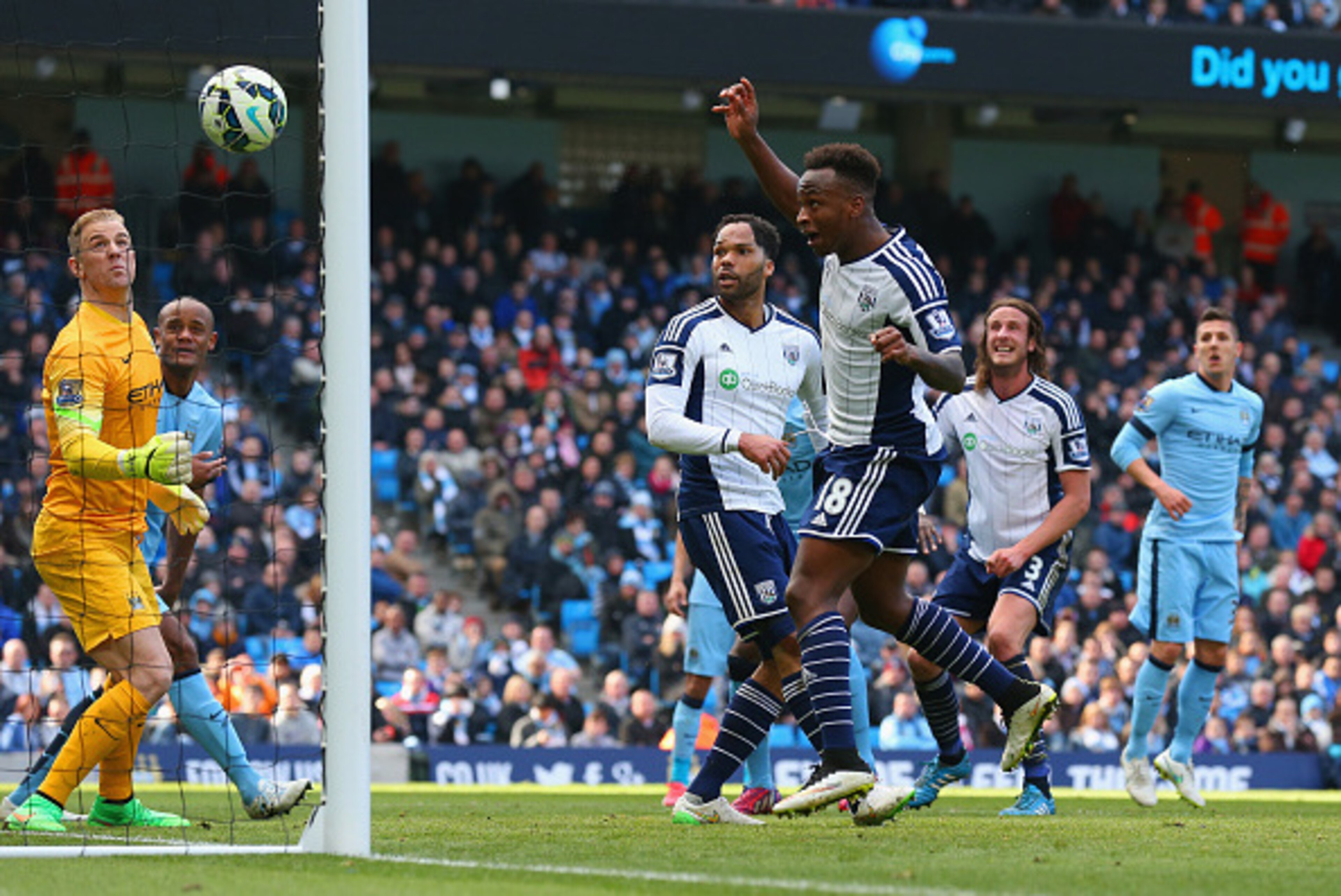 MANCHESTER, ENGLAND - MARCH 21: Joe Hart of Manchester City looks on as Saido Berahino of West Brom hits the cross bar during the Barclays Premier League match between Manchester City and West Bromwich Albion at Etihad Stadium on March 21, 2015 in Manches