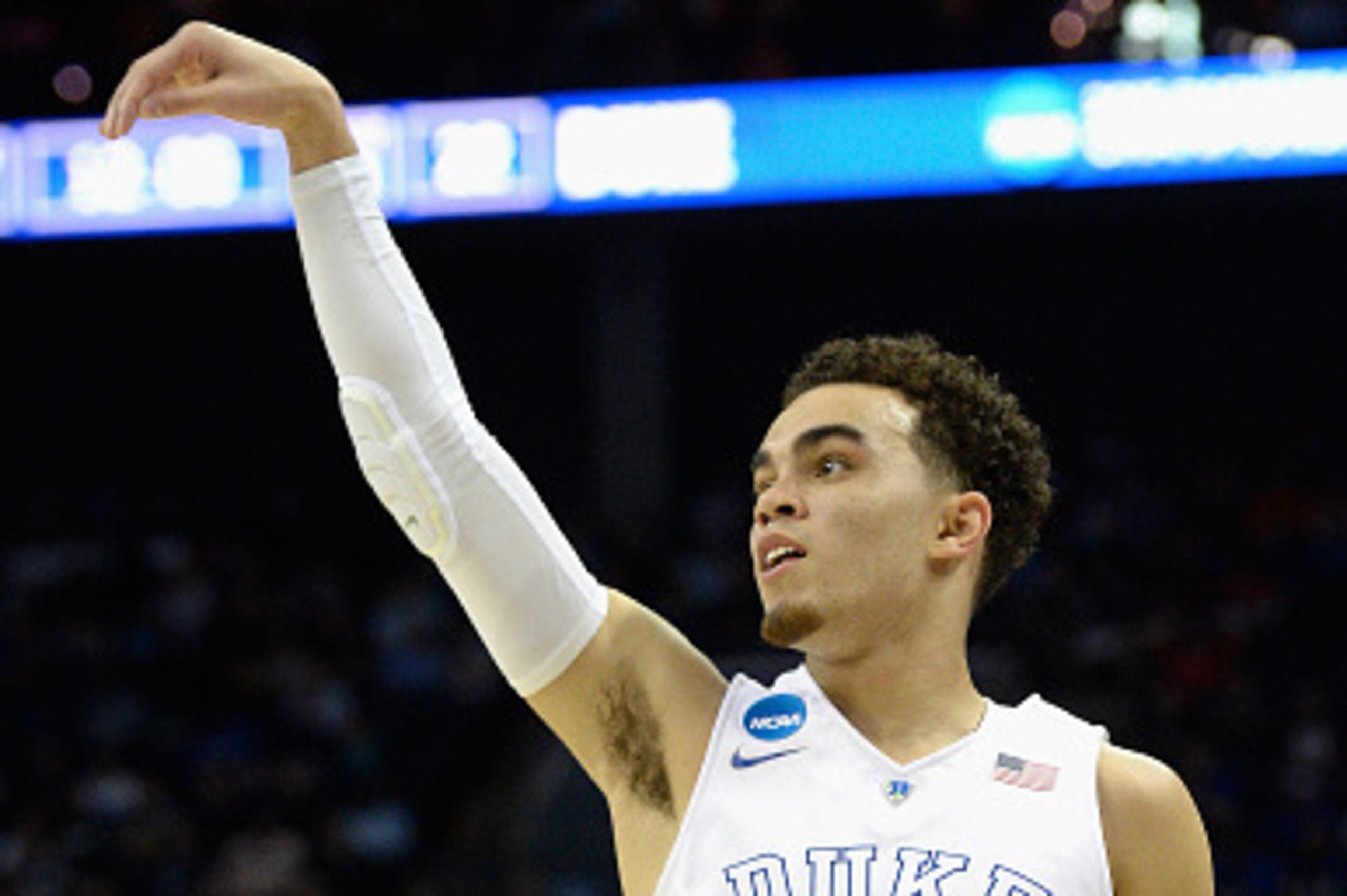 CHARLOTTE, NC - MARCH 20:  Tyus Jones #5 of the Duke Blue Devils reacts after his shot against the Robert Morris Colonials during the second round of the 2015 NCAA Men's Basketball Tournament at Time Warner Cable Arena on March 20, 2015 in Charlotte, Nort