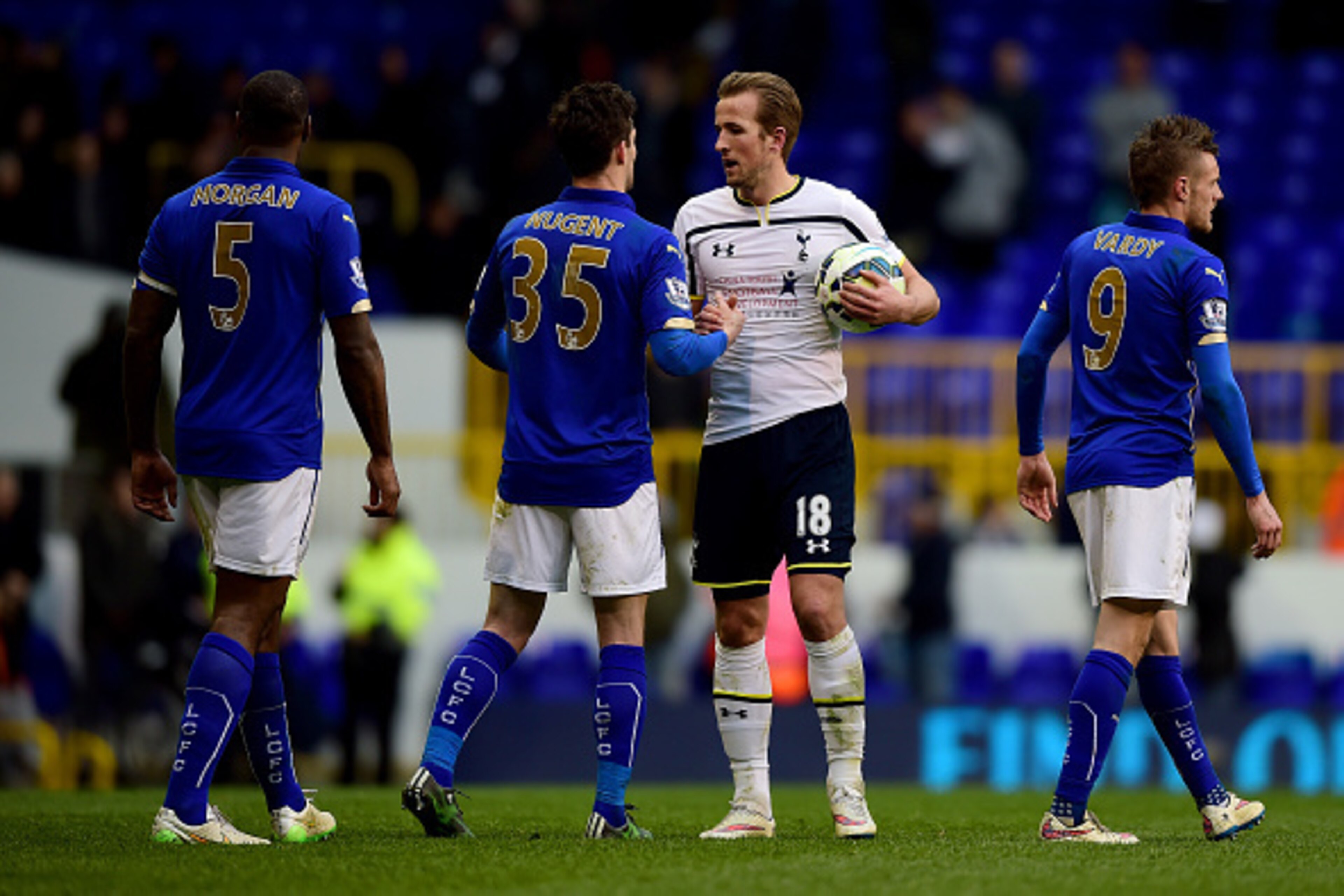 LONDON, ENGLAND - MARCH 21:  Harry Kane of Spurs is congratulated by David Nugent of Leicester City after collecting the match ball following his hat-trick during the Barclays Premier League match between Tottenham Hotspur and Leicester City at White Hart