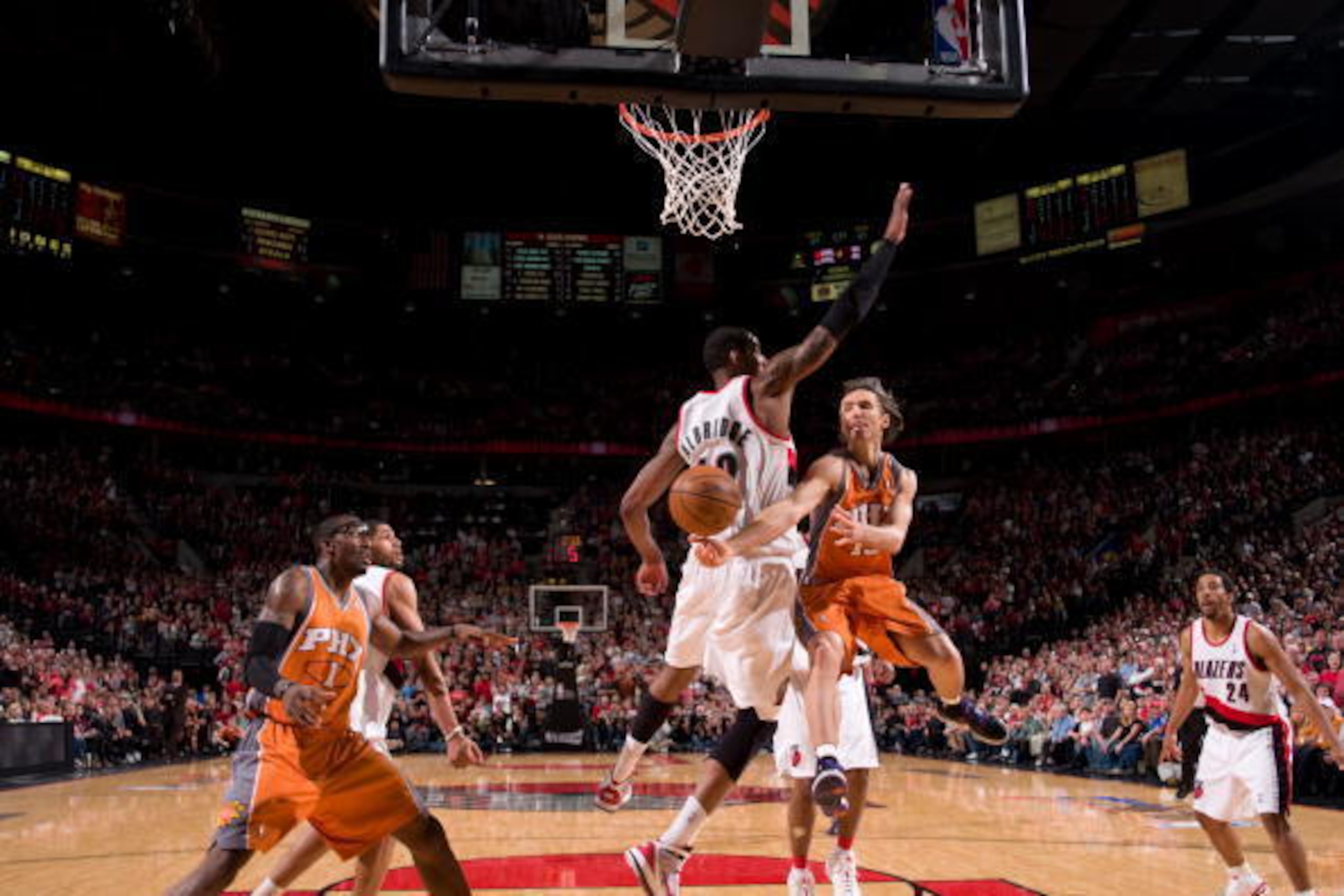 PORTLAND, OR - APRIL 24: Steve Nash #13 of the Phoenix Suns throws a pass around LaMarcus Aldridge #12 of the Portland Trail Blazers in Game Four of the Western Conference Quarterfinals during the 2010 NBA Playoffs on April 24, 2010 at the Rose Garden Are