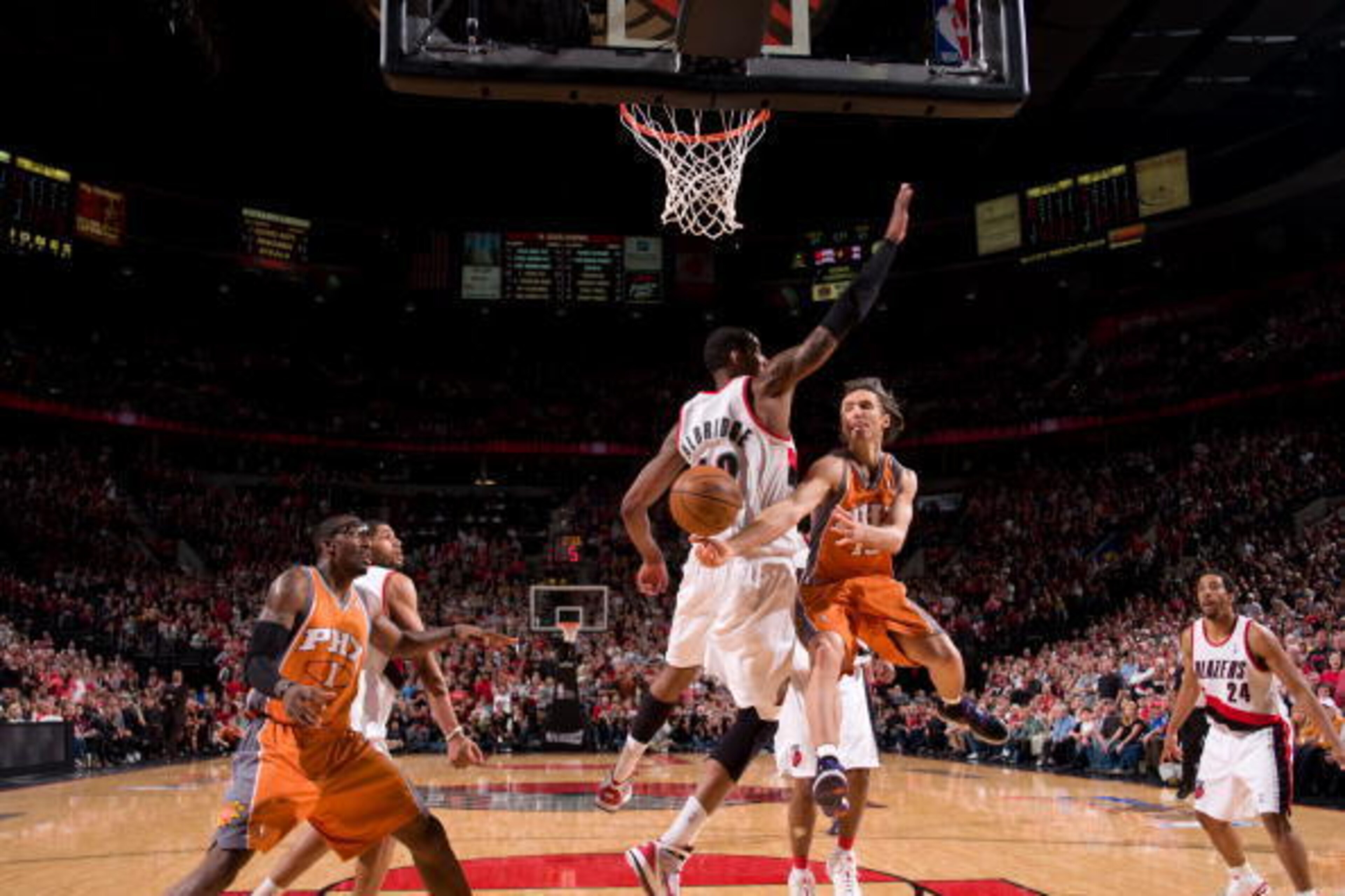 PORTLAND, OR - APRIL 24: Steve Nash #13 of the Phoenix Suns throws a pass around LaMarcus Aldridge #12 of the Portland Trail Blazers in Game Four of the Western Conference Quarterfinals during the 2010 NBA Playoffs on April 24, 2010 at the Rose Garden Are PORTLAND, OR - APRIL 24: Steve Nash #13 of the Phoenix Suns throws a pass around LaMarcus Aldridge #12 of the Portland Trail Blazers in Game Four of the Western Conference Quarterfinals during the 2010 NBA Playoffs on April 24, 2010 at the Rose Garden Are