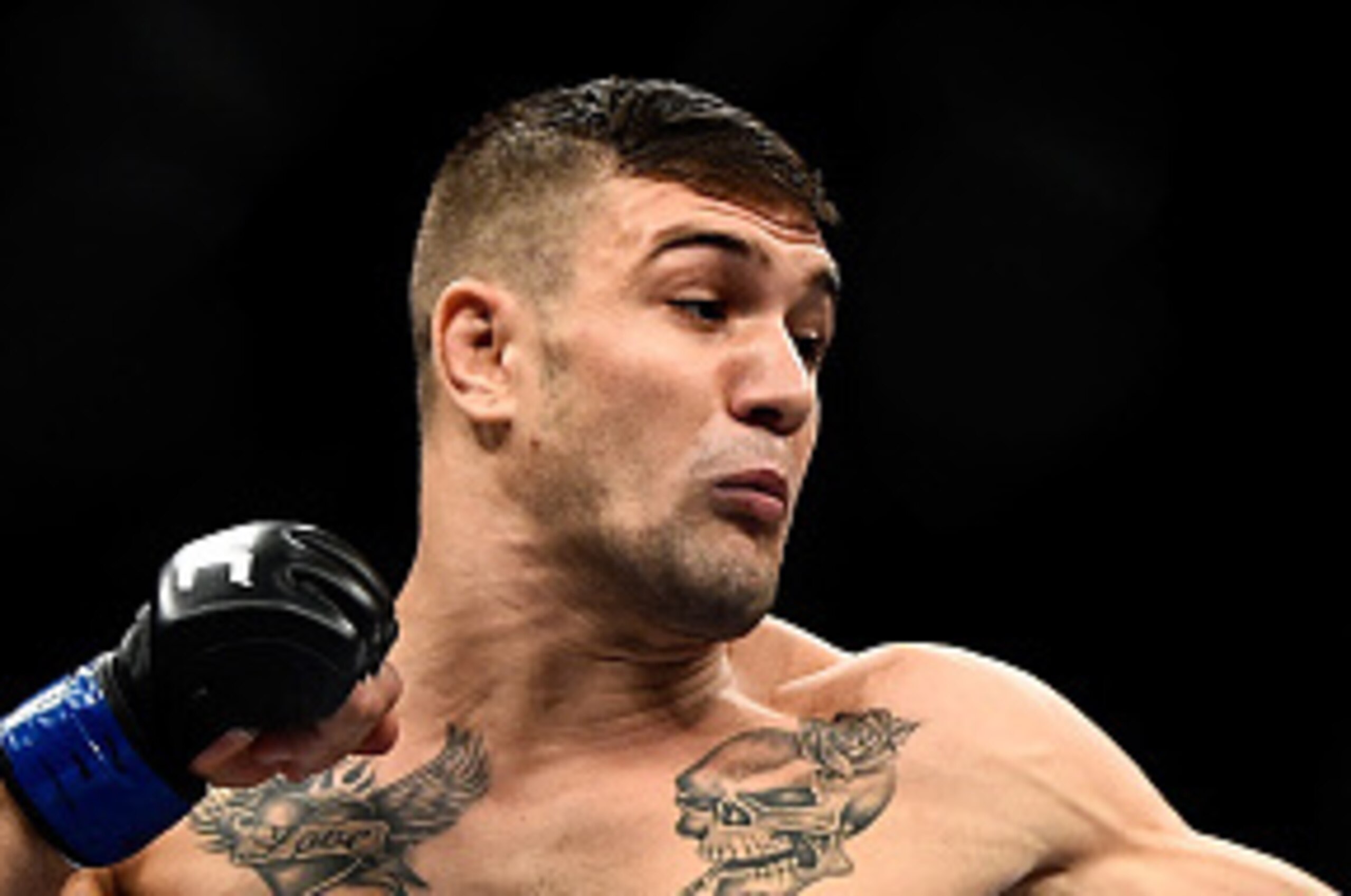 RIO DE JANEIRO, BRAZIL - OCTOBER 25:  Christos Giagos of the United States punches Gilbert Burns of Brazil in their lightweight bout during the UFC 179 event at Maracanazinho on October 25, 2014 in Rio de Janeiro, Brazil.  (Photo by Buda Mendes/Getty Imag