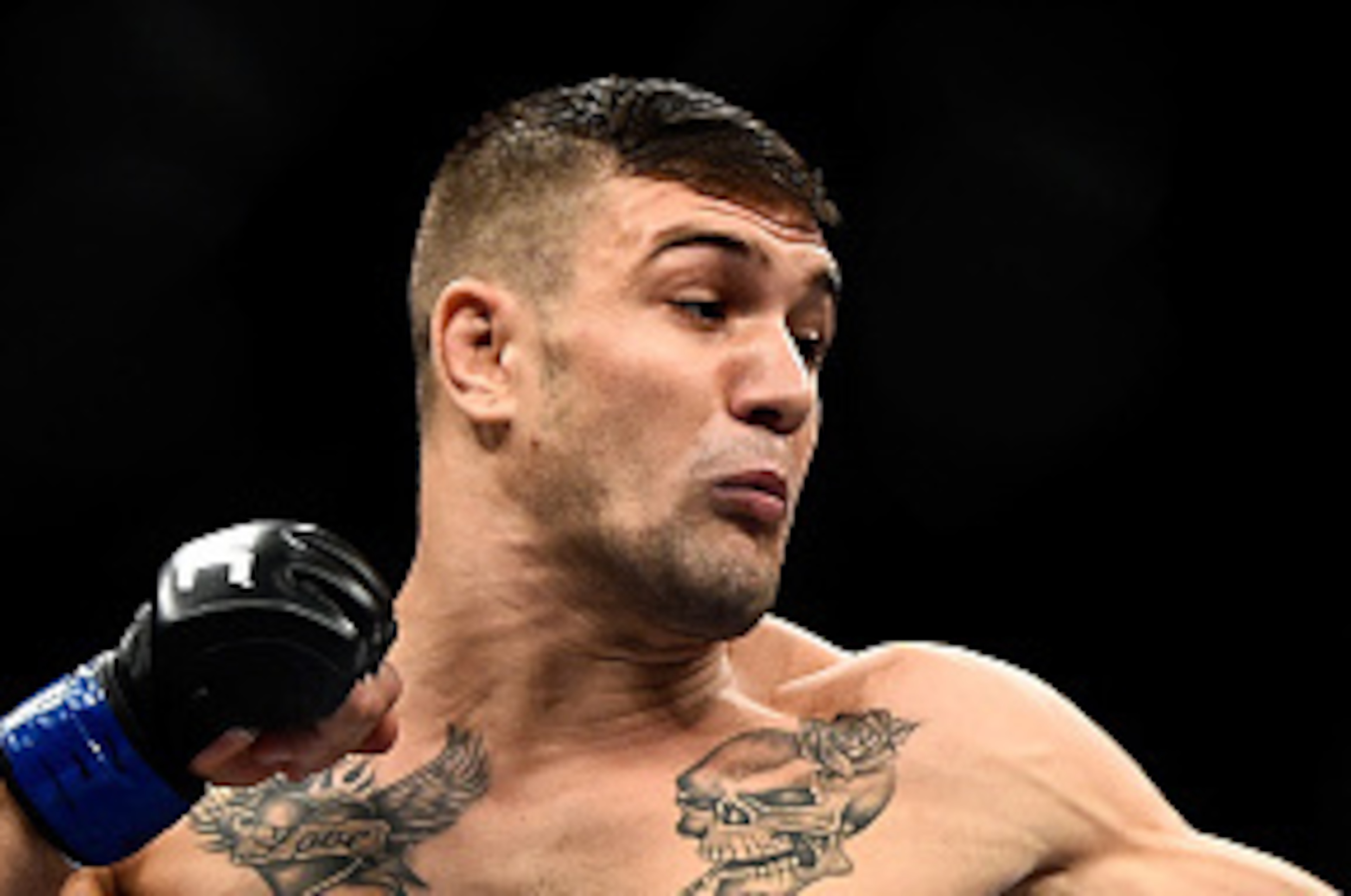 RIO DE JANEIRO, BRAZIL - OCTOBER 25:  Christos Giagos of the United States punches Gilbert Burns of Brazil in their lightweight bout during the UFC 179 event at Maracanazinho on October 25, 2014 in Rio de Janeiro, Brazil.  (Photo by Buda Mendes/Getty Imag