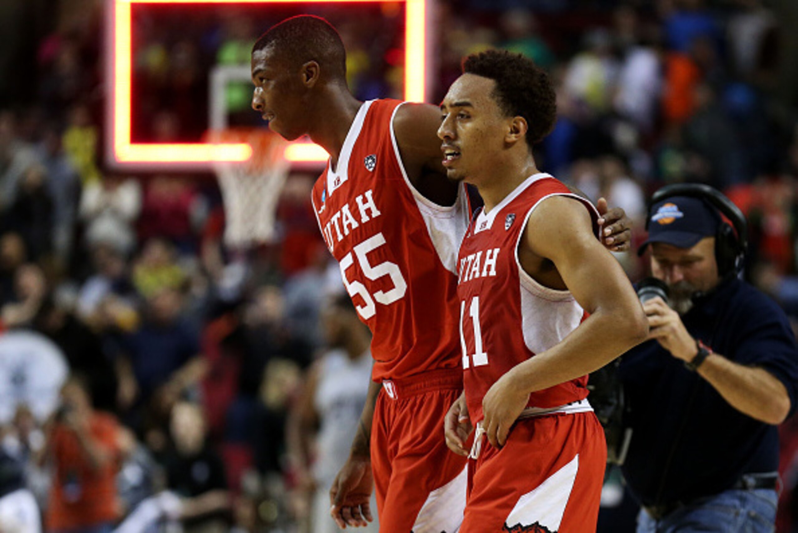 PORTLAND, OR - MARCH 21:  Brandon Taylor #11 and Delon Wright #55 of the Utah Utes celebrate their 75 to 64 win over the Georgetown Hoyas during the third round of the 2015 NCAA Men's Basketball Tournament at Moda Center on March 21, 2015 in Portland, Ore