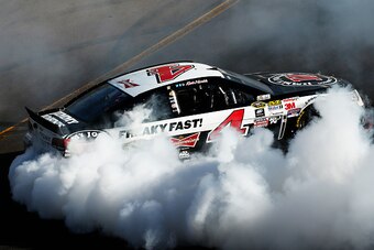 AVONDALE, AZ - MARCH 15:  Kevin Harvick, driver of the #4 Jimmy John's/ Budweiser Chevrolet, celebrates with a burnout after winning the NASCAR Sprint Cup Series CampingWorld.com 500 at Phoenix International Raceway on March 15, 2015 in Avondale, Arizona.