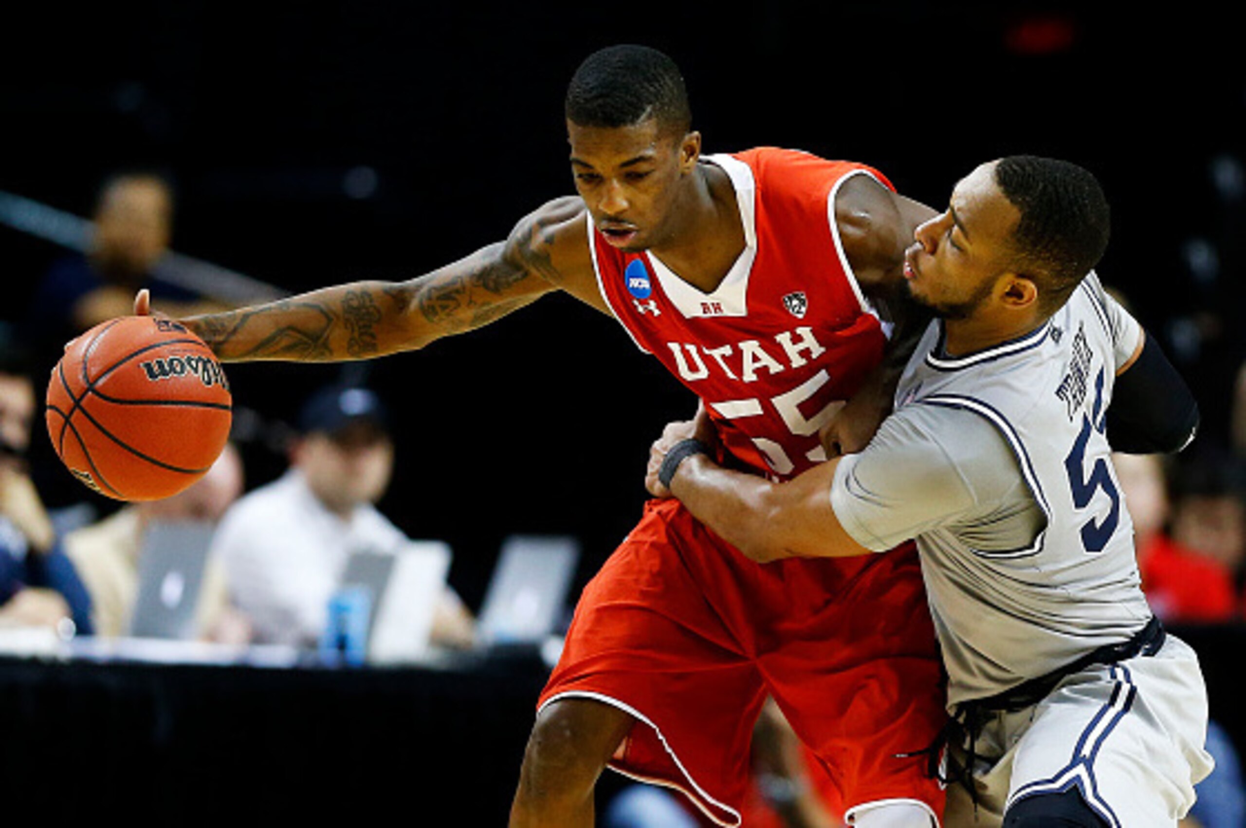 PORTLAND, OR - MARCH 21:  Delon Wright #55 of the Utah Utes drives against Jabril Trawick #55 of the Georgetown Hoyas in the second half during the third round of the 2015 NCAA Men's Basketball Tournament at Moda Center on March 21, 2015 in Portland, Oreg