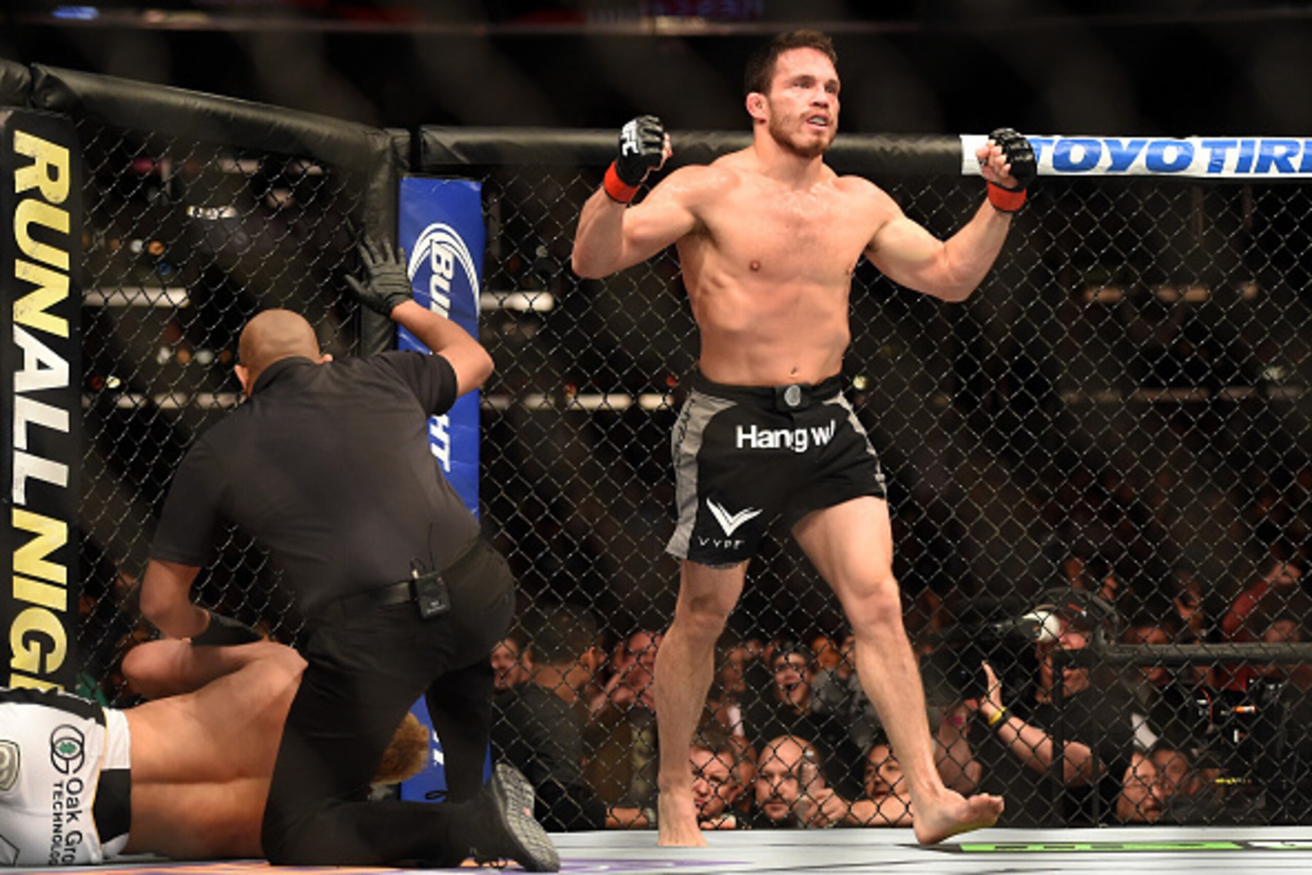 LOS ANGELES, CA - FEBRUARY 28:  Jake Ellenberger celebrates his submission victory over Josh Koscheck in their welterweight bout during the UFC 184 event at Staples Center on February 28, 2015 in Los Angeles, California.  (Photo by Harry How/Getty Images)