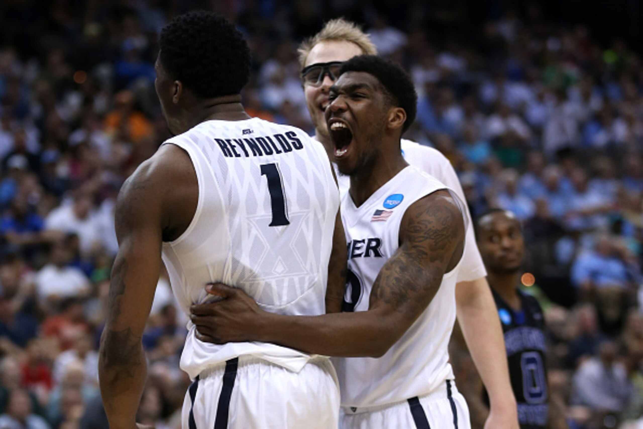 JACKSONVILLE, FL - MARCH 21:  Jalen Reynolds #1 of the Xavier Musketeers celebrates a defensive foul on the Georgia State Panthers with teammates Remy Abell #10 and Matt Stainbrook #40 in the second half during the third round of the 2015 NCAA Men's Baske