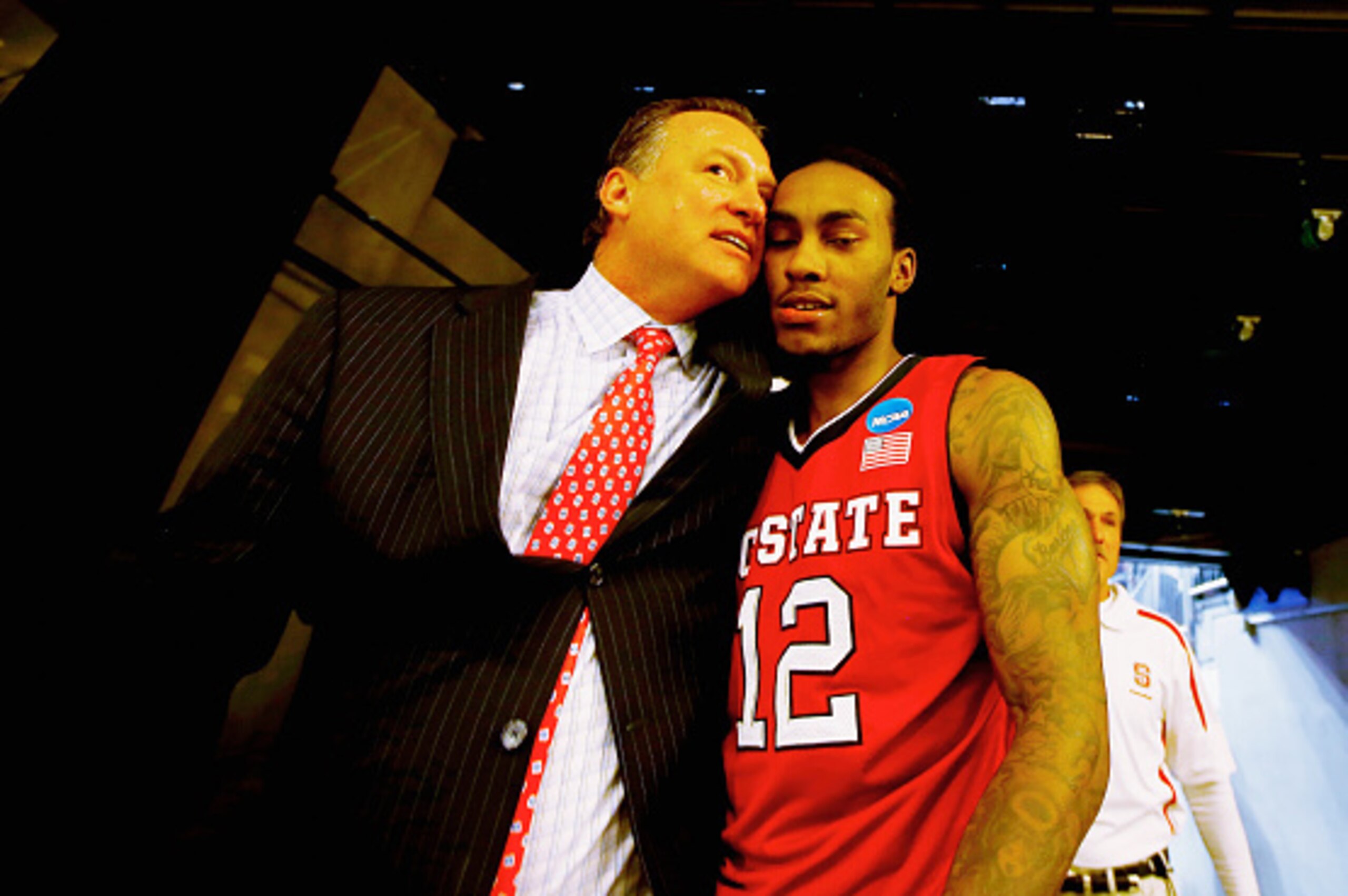 PITTSBURGH, PA - MARCH 21: Head coach Mark Gottfried walks off the floor with Anthony Barber #12 of the North Carolina State Wolfpack following their 71-68 win over the Villanova Wildcats during the third round of the 2015 NCAA Men's Basketball Tournamen PITTSBURGH, PA - MARCH 21: Head coach Mark Gottfried walks off the floor with Anthony Barber #12 of the North Carolina State Wolfpack following their 71-68 win over the Villanova Wildcats during the third round of the 2015 NCAA Men's Basketball Tournamen