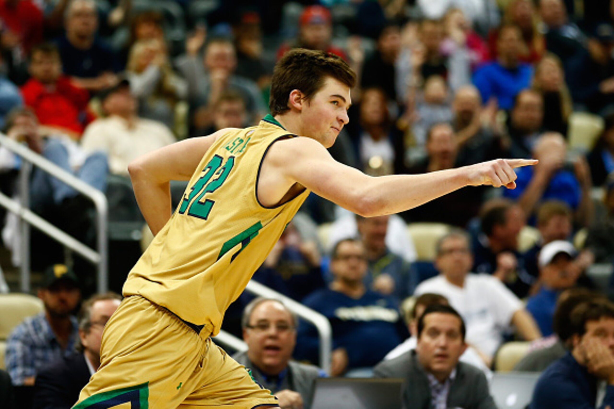 PITTSBURGH, PA - MARCH 21: Steve Vasturia #32 of the Notre Dame Fighting Irish celebrates after sinking a three pointer against the Butler Bulldogs in overtime during the third round of the 2015 NCAA Men's Basketball Tournament at Consol Energy Center on 