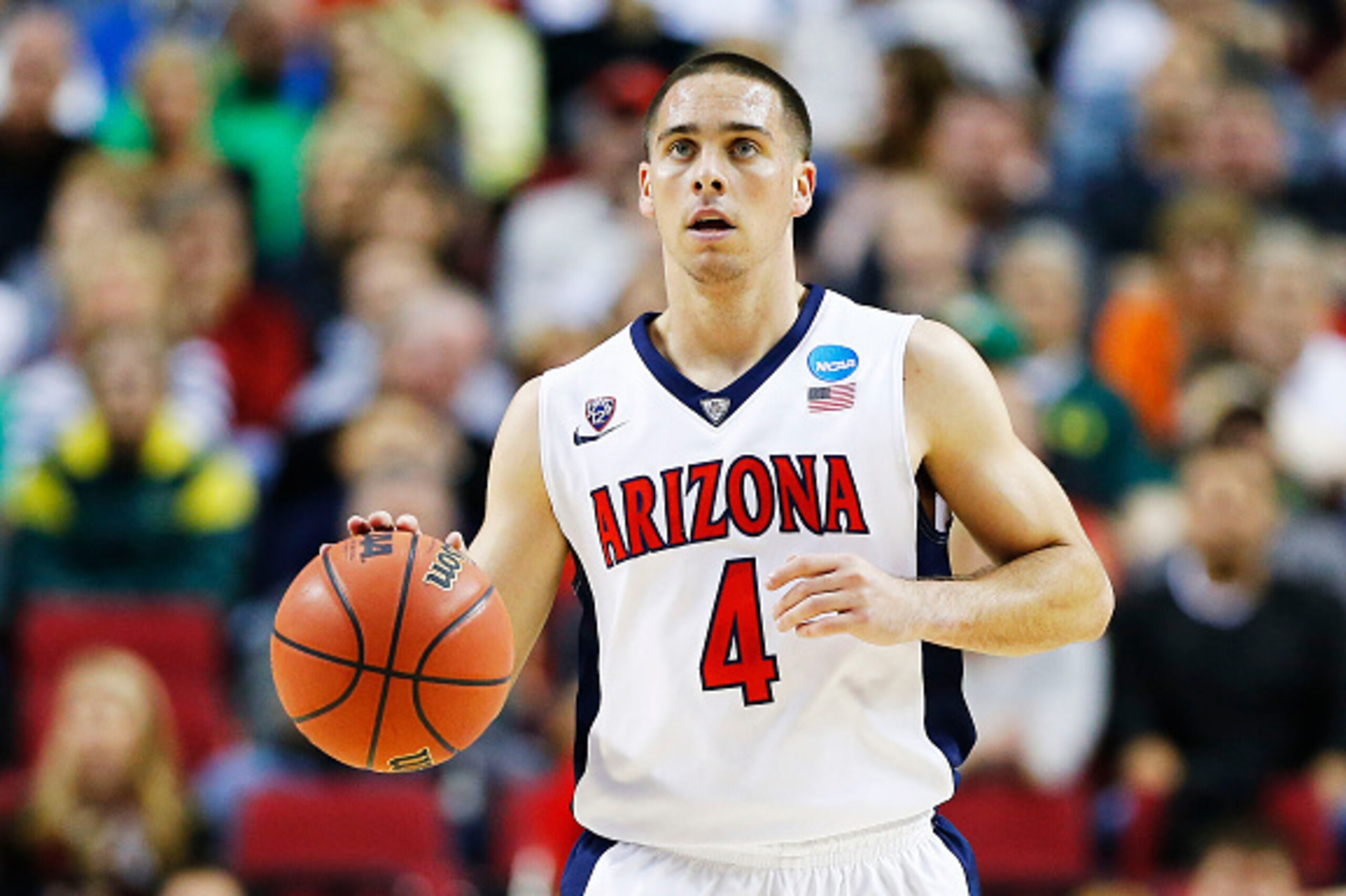 PORTLAND, OR - MARCH 21: T.J. McConnell #4 of the Arizona Wildcats drives against the Ohio State Buckeyes in the first half during the third round of the 2015 NCAA Men's Basketball Tournament at Moda Center on March 21, 2015 in Portland, Oregon. (Photo PORTLAND, OR - MARCH 21: T.J. McConnell #4 of the Arizona Wildcats drives against the Ohio State Buckeyes in the first half during the third round of the 2015 NCAA Men's Basketball Tournament at Moda Center on March 21, 2015 in Portland, Oregon. (Photo