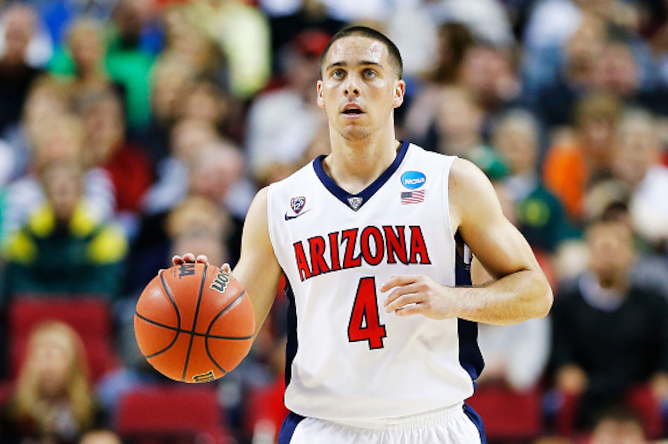 PORTLAND, OR - MARCH 21:  T.J. McConnell #4 of the Arizona Wildcats drives against the Ohio State Buckeyes in the first half during the third round of the 2015 NCAA Men's Basketball Tournament at Moda Center on March 21, 2015 in Portland, Oregon.  (Photo 