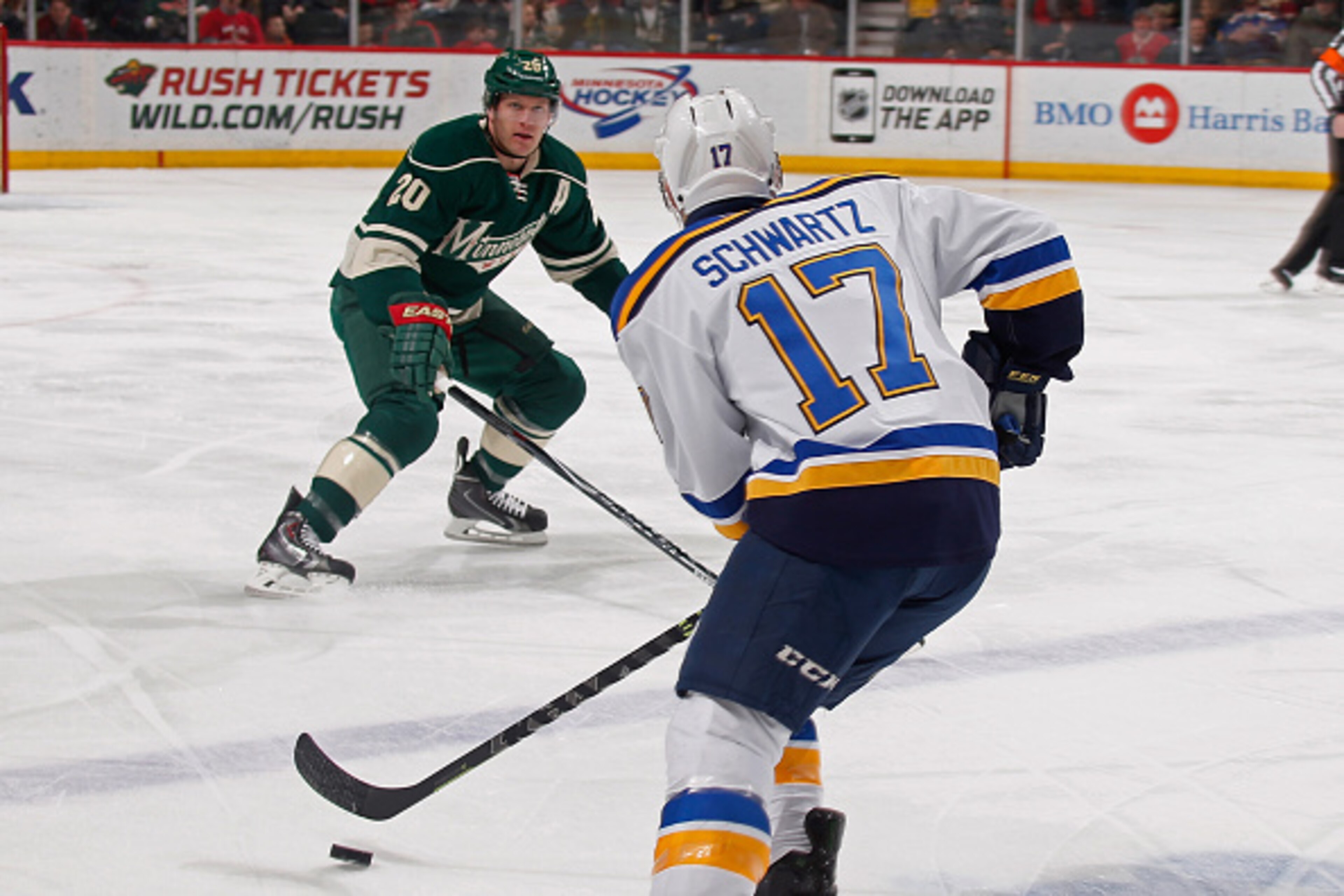 ST. PAUL, MN - MARCH 21: Jaden Schwartz #17 of the St. Louis Blues skates with the puck while Ryan Suter #20 of the Minnesota Wild defends during the game on March 21, 2015 at the Xcel Energy Center in St. Paul, Minnesota. (Photo by Bruce Kluckhohn/NHLI v