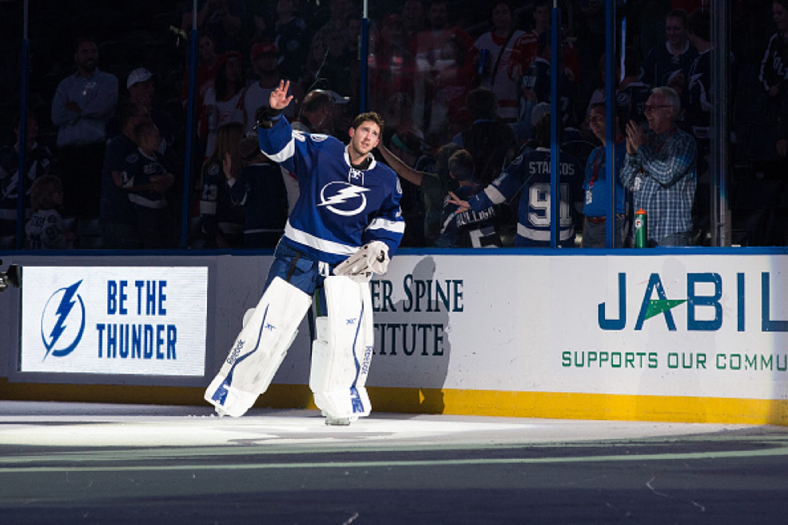 TAMPA, FL - MARCH 20: Goalie Ben Bishop #30 of the Tampa Bay Lightning thanks fans for their support after the win  against the Detroit Red Wings at the Amalie Arena on March 20, 2015 in Tampa, Florida.  (Photo by Scott Audette/NHLI via Getty Images)