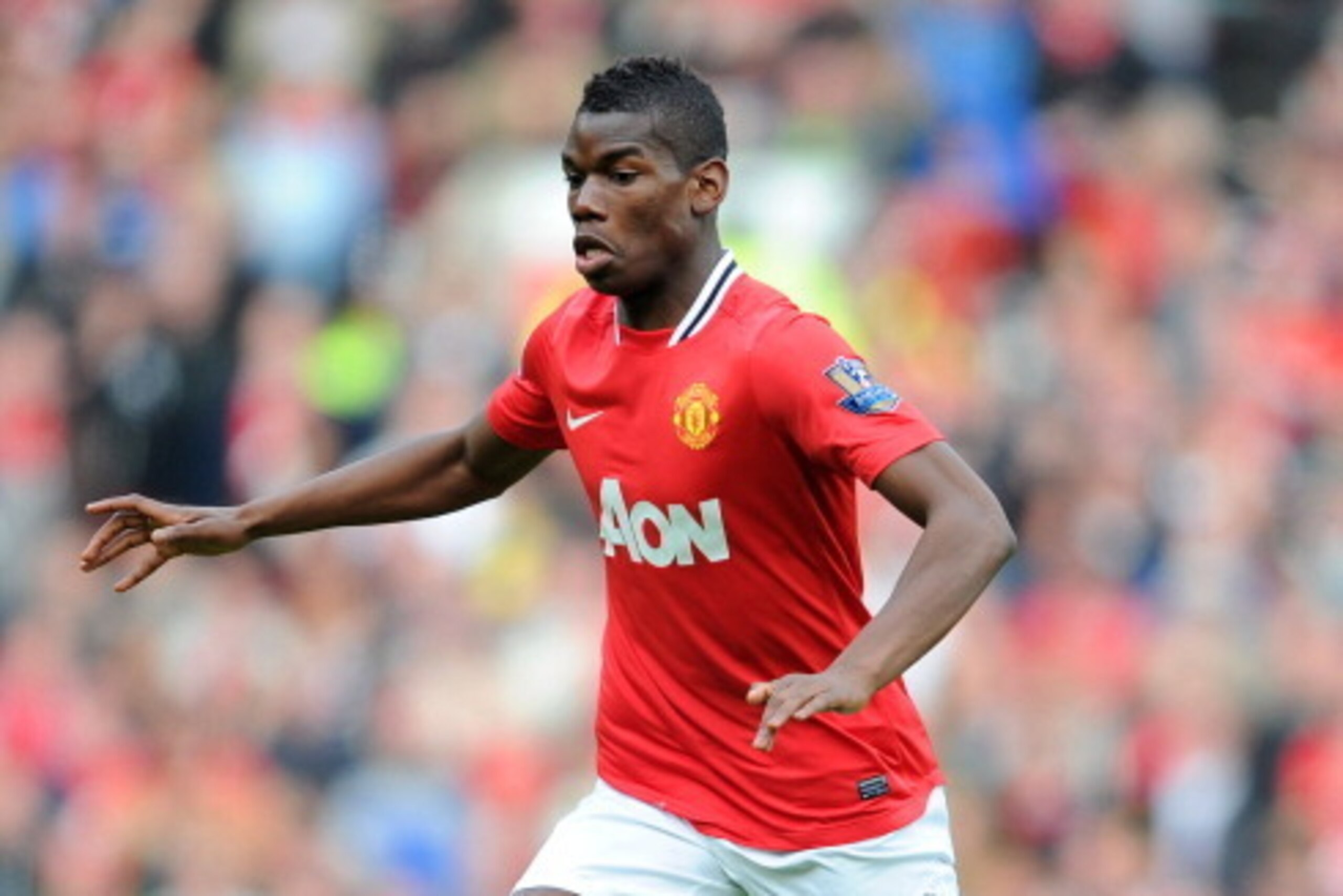 MANCHESTER, ENGLAND - MARCH 11:  Paul Pogba of Manchester United in action during the Barclays Premier League match between Manchester United and West Bromwich Albion at Old Trafford on March 11, 2012 in Manchester, England.  (Photo by Michael Regan/Getty