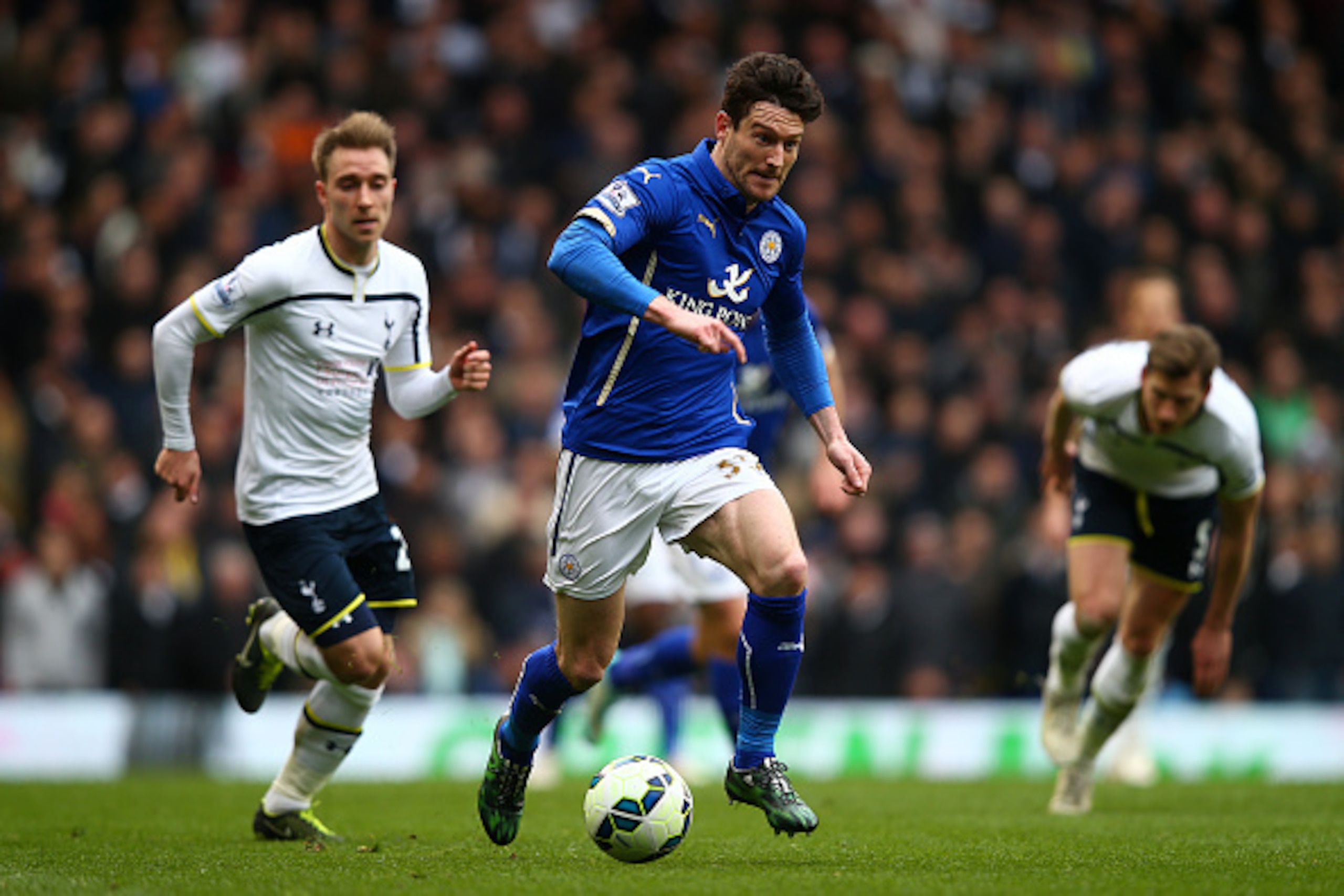 LONDON, ENGLAND - MARCH 21:  David Nugent of Leicester City runs with the ball under pressure from Christian Eriksen of Spurs during the Barclays Premier League match between Tottenham Hotspur and Leicester City at White Hart Lane on March 21, 2015 in Lon