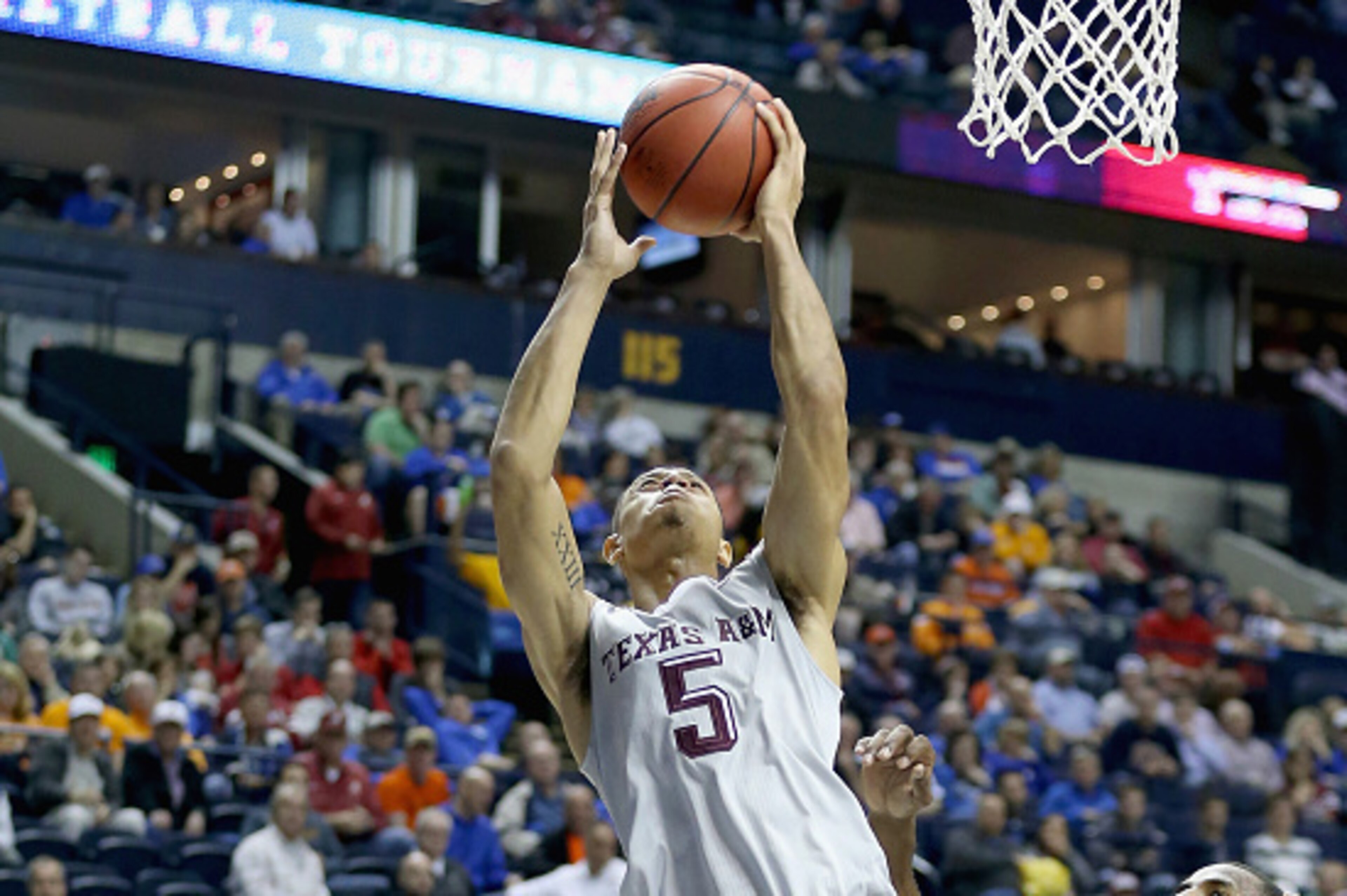 NASHVILLE, TN - MARCH 12:  Jordan Green #5 of the Texas A&M Aggies shoots the ball against the Auburn Tigers during the second round game of the SEC Basketball Tournament at Bridgestone Arena on March 12, 2015 in Nashville, Tennessee.  (Photo by Andy Lyon