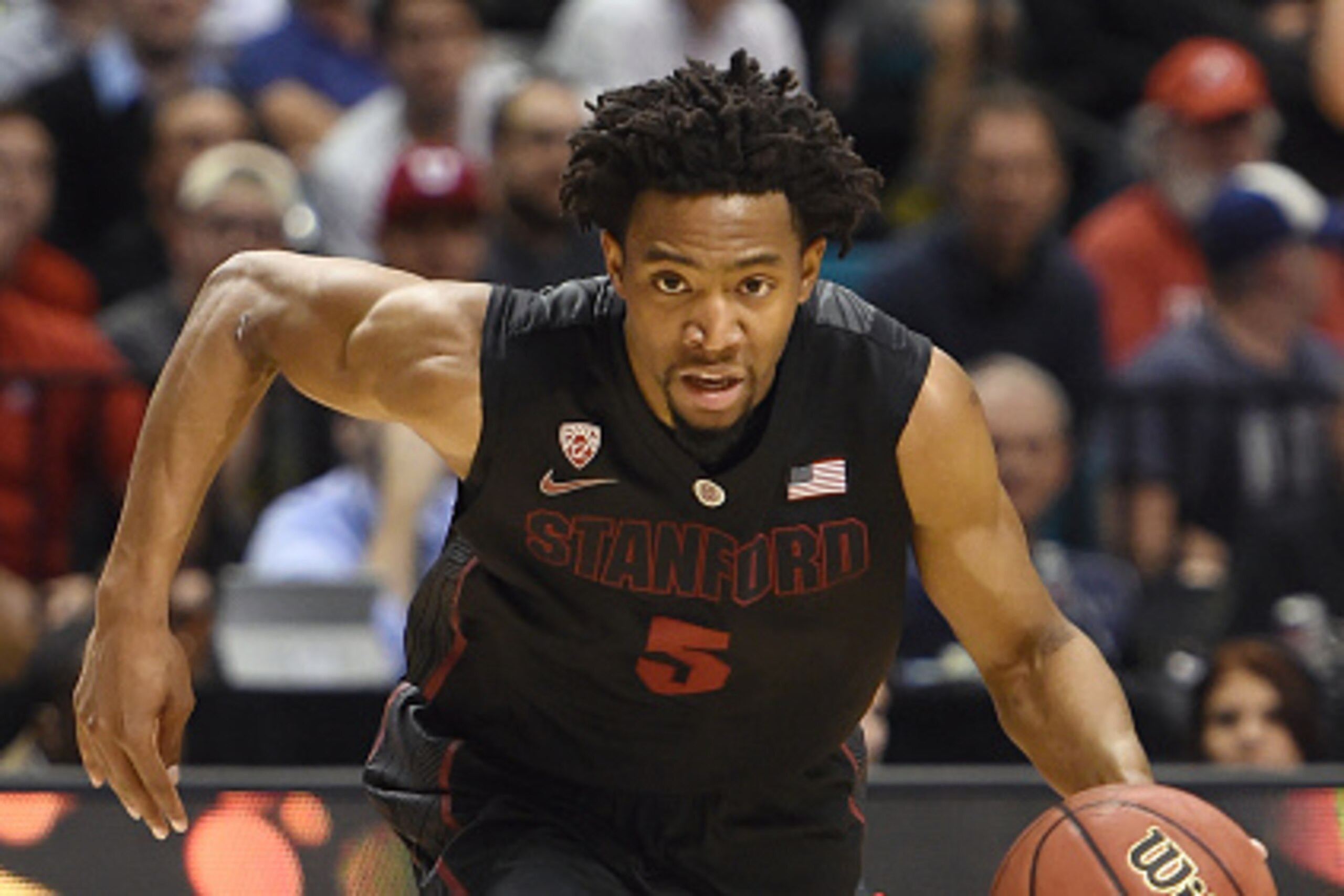 LAS VEGAS, NV - MARCH 12: Chasson Randle #5 of the Stanford Cardinal brings the ball up the court against the Utah Utes during a quarterfinal game of the Pac-12 Basketball Tournament at the MGM Grand Garden Arena on March 12, 2015 in Las Vegas, Nevada. U LAS VEGAS, NV - MARCH 12: Chasson Randle #5 of the Stanford Cardinal brings the ball up the court against the Utah Utes during a quarterfinal game of the Pac-12 Basketball Tournament at the MGM Grand Garden Arena on March 12, 2015 in Las Vegas, Nevada. U
