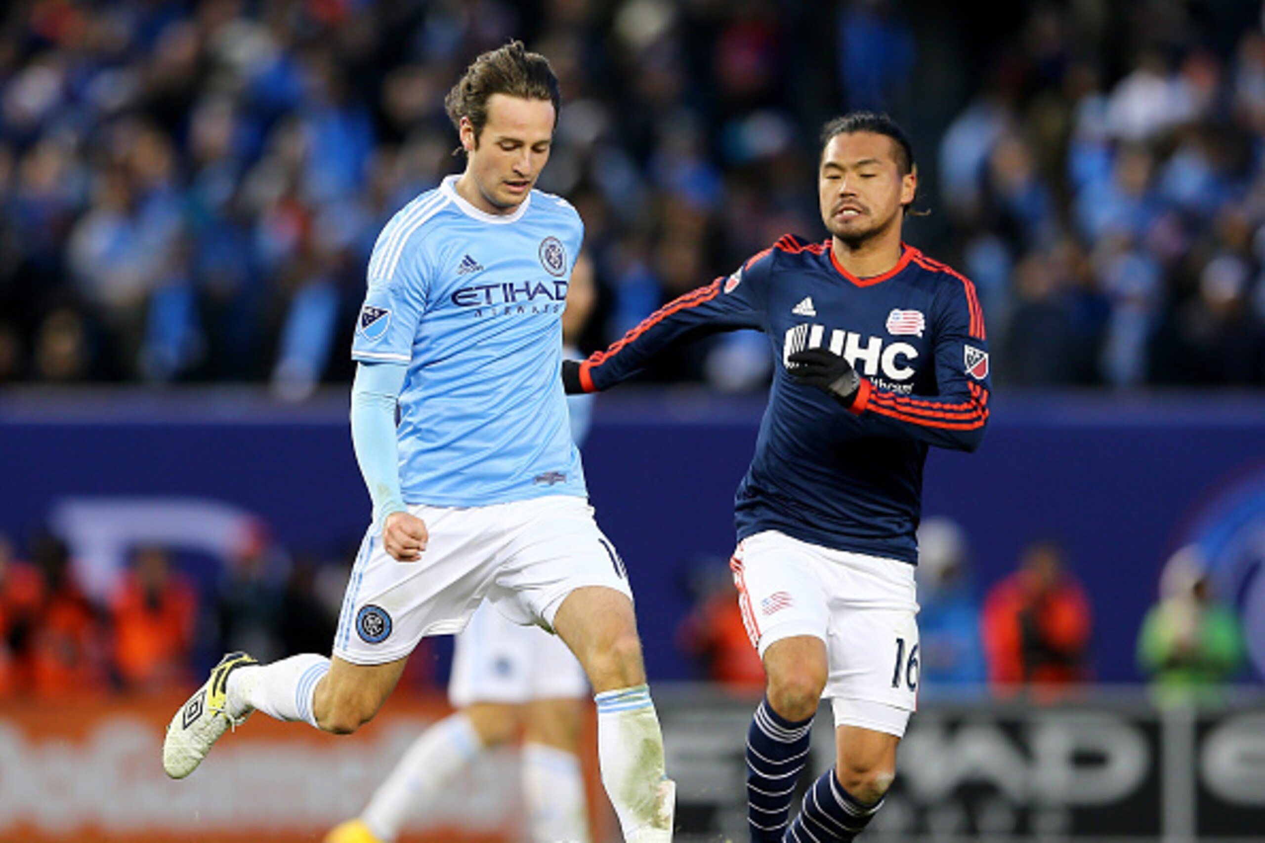 NEW YORK, NY - MARCH 15:  Mix Diskerud #10 of New York City FC takes the ball as Daigo Kobayashi #16 of New England Revolution defends during the inaugural game of the New York City FC at Yankee Stadium on March 15, 2015 in the Bronx borough of New York C