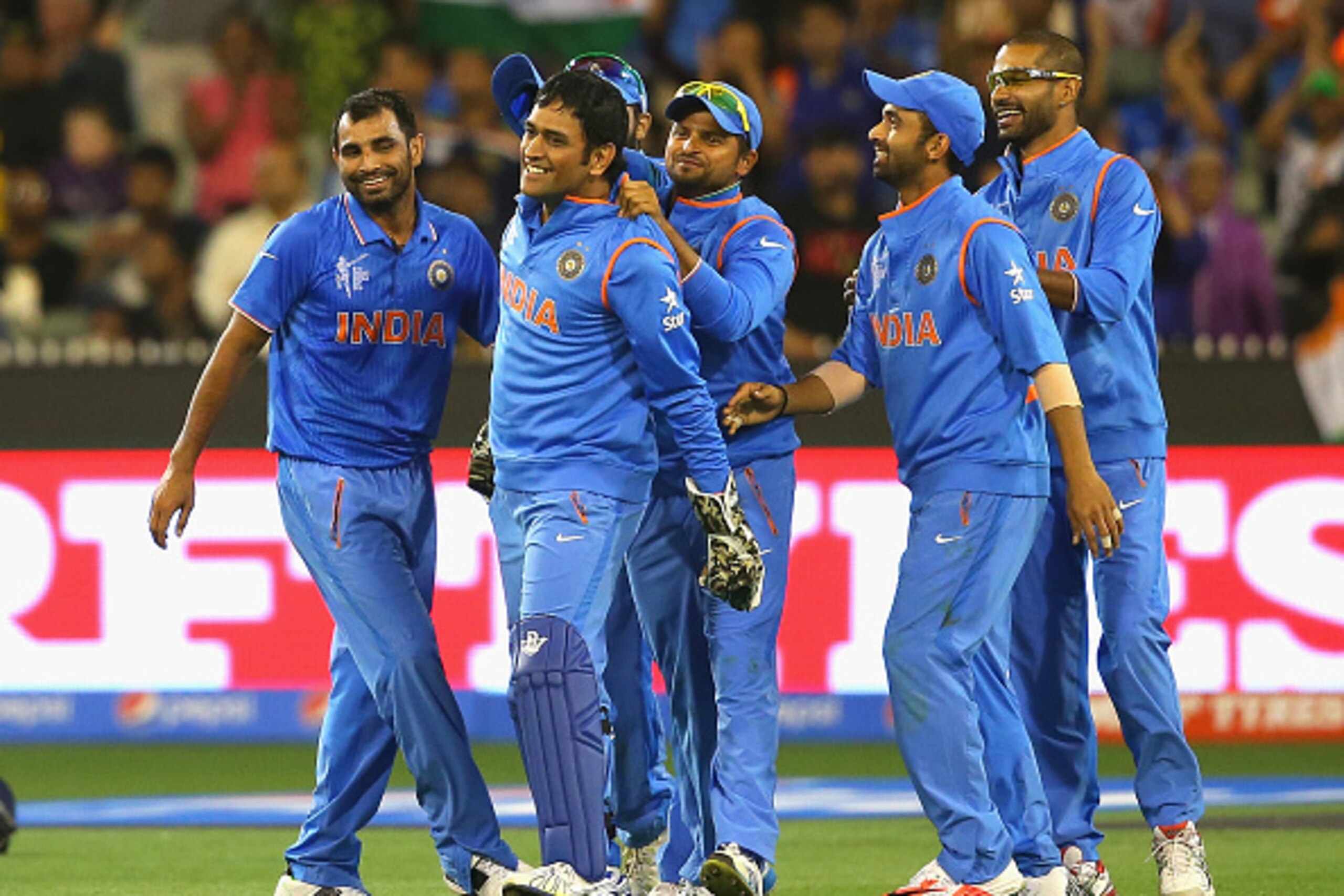 MELBOURNE, AUSTRALIA - MARCH 19:  MS Dhoni of India is congratulated by team mates after getting the wicket of Soumya Sarkar of Bangladesh during the 2015 ICC Cricket World Cup Quater Final match between India and Bangldesh at Melbourne Cricket Ground on 