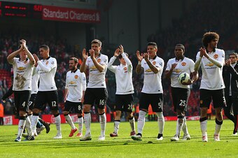 LIVERPOOL, ENGLAND - MARCH 22:  Manchester United players celebrate victory after the Barclays Premier League match between Liverpool and Manchester United at Anfield on March 22, 2015 in Liverpool, England.  (Photo by Alex Livesey/Getty Images)