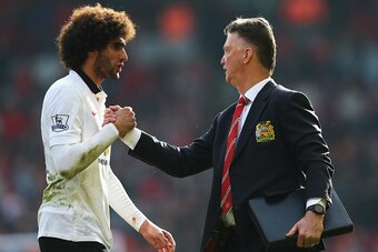 LIVERPOOL, ENGLAND - MARCH 22:  Louis van Gaal, manager of Manchester United celebrates with Marouane Fellaini of Manchester United after the Barclays Premier League match between Liverpool and Manchester United at Anfield on March 22, 2015 in Liverpool, 