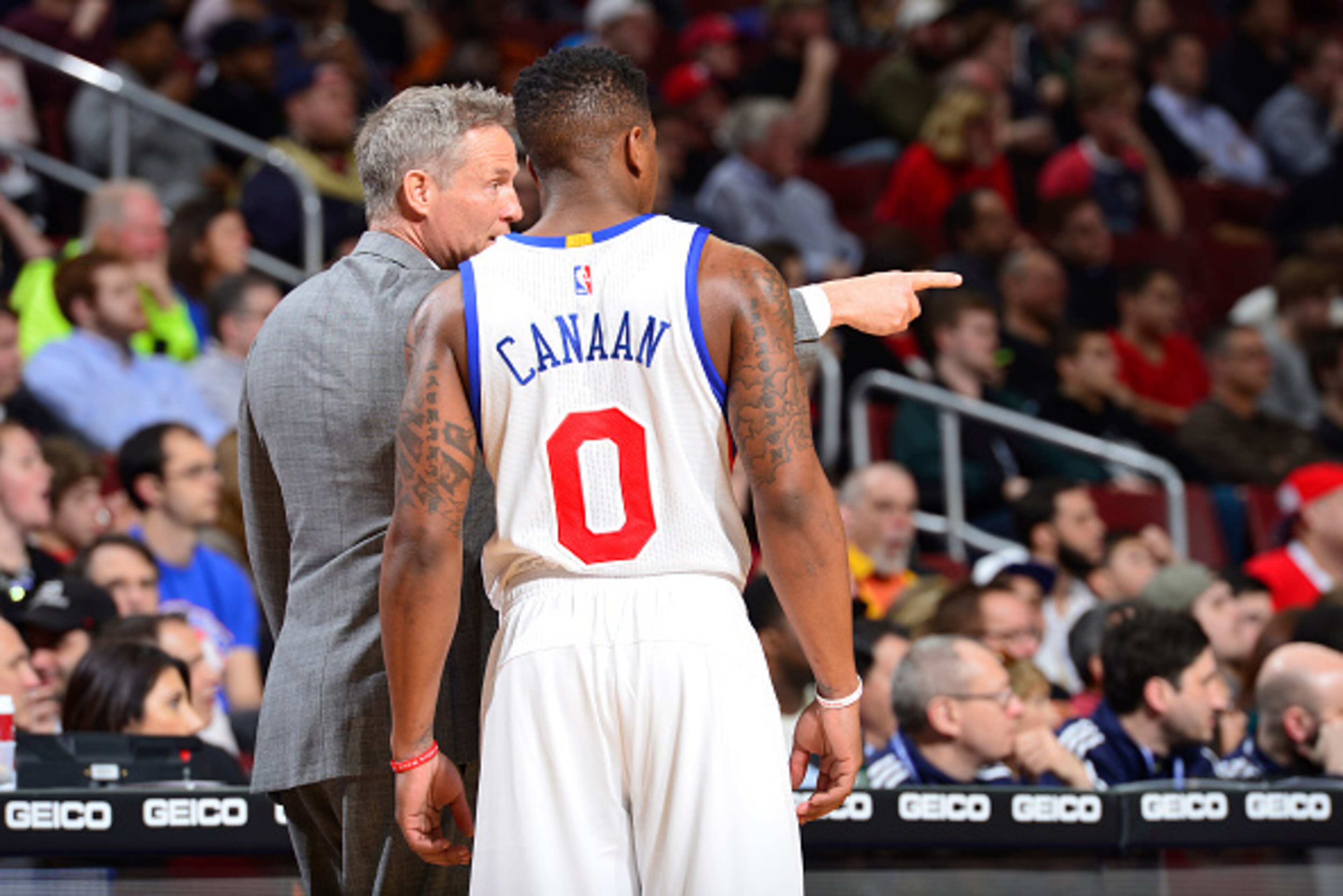 PHILADELPHIA - MARCH 11: Head Coach Brett Brown of the Philadelphia 76ers gives instruction to his point guard Isaiah Canaan #0 against the Chicago Bulls at the Wells Fargo Center on March 11, 2015 in Philadelphia, Pennsylvania. NOTE TO USER: User expre PHILADELPHIA - MARCH 11: Head Coach Brett Brown of the Philadelphia 76ers gives instruction to his point guard Isaiah Canaan #0 against the Chicago Bulls at the Wells Fargo Center on March 11, 2015 in Philadelphia, Pennsylvania. NOTE TO USER: User expre