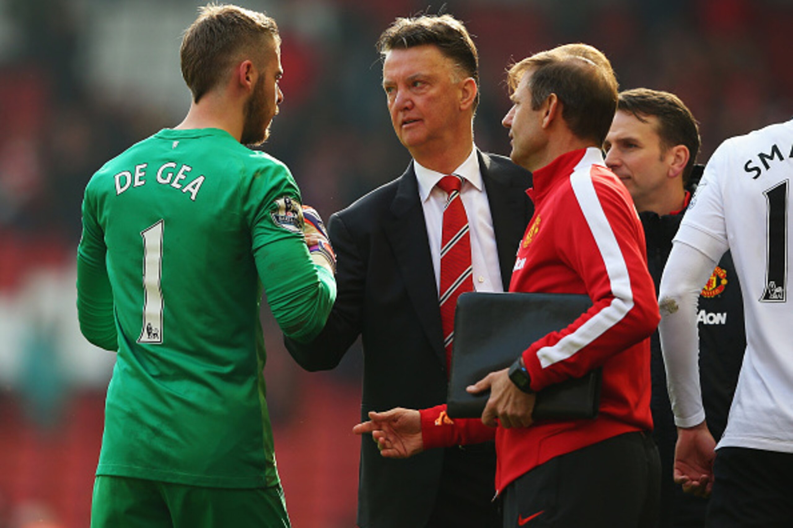 LIVERPOOL, ENGLAND - MARCH 22:  Louis van Gaal, manager of Manchester United celebrates victory with David De Gea of Manchester United after the Barclays Premier League match between Liverpool and Manchester United at Anfield on March 22, 2015 in Liverpoo