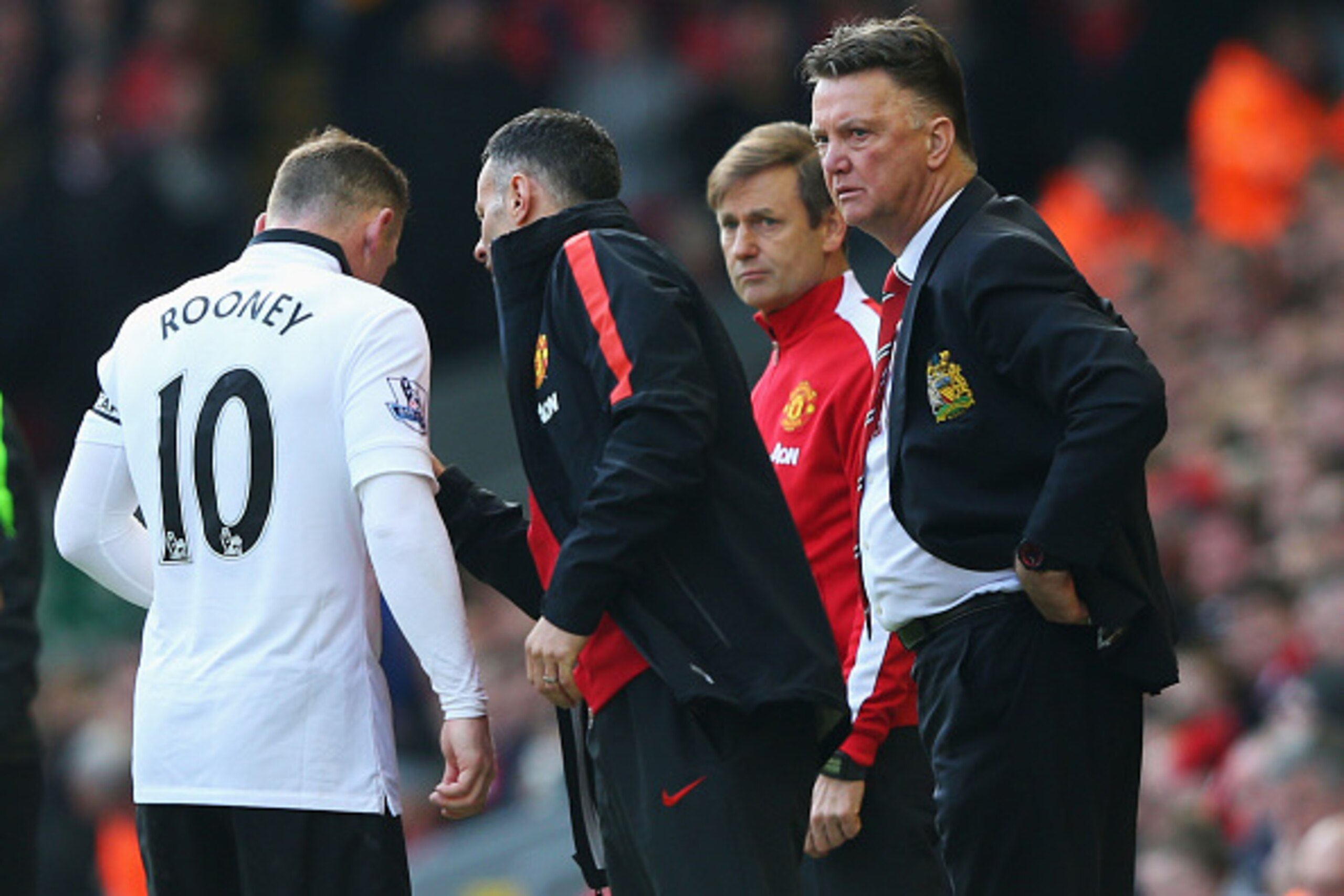 LIVERPOOL, ENGLAND - MARCH 22: Louis van Gaal, manager of Manchester United and assistant Ryan Giggs talk to Wayne Rooney during the Barclays Premier League match between Liverpool and Manchester United at Anfield on March 22, 2015 in Liverpool, England. 