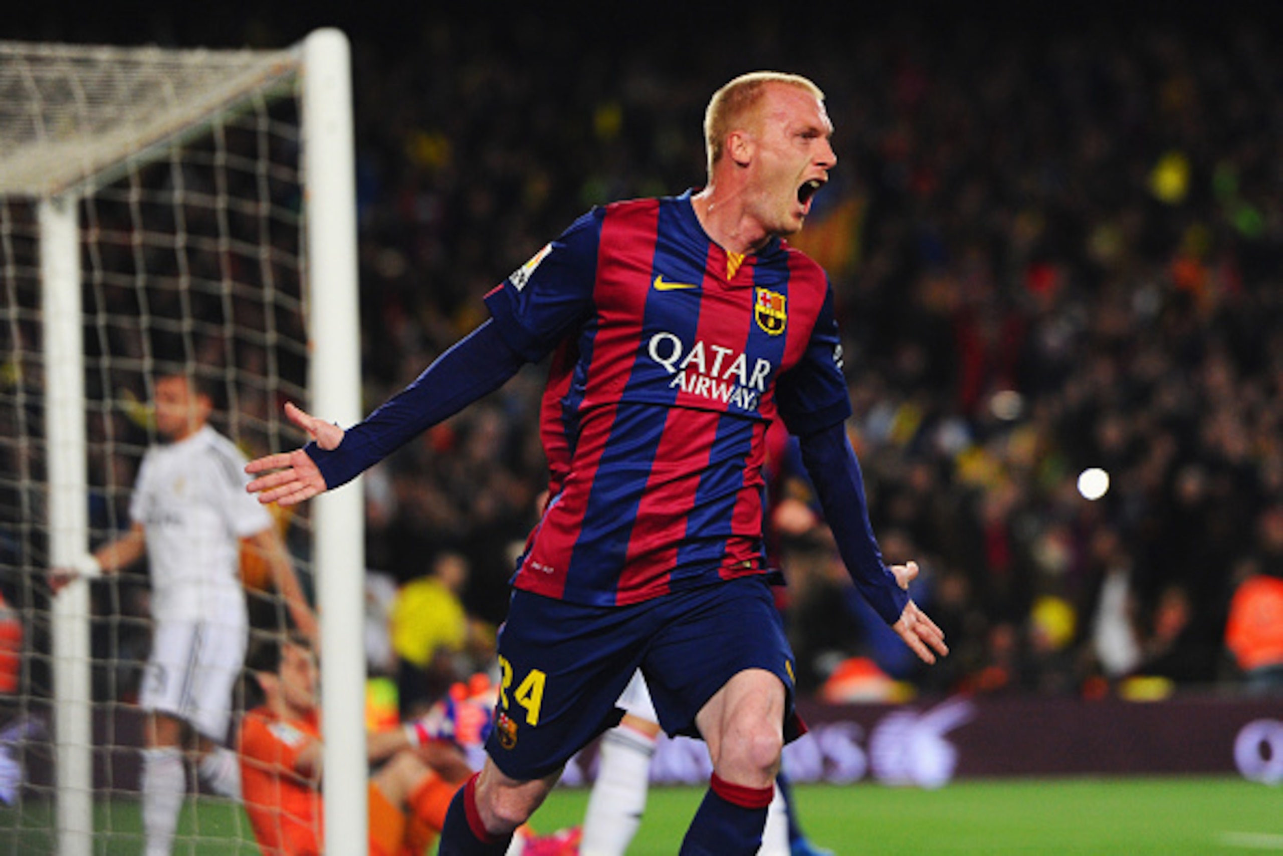 BARCELONA, SPAIN - MARCH 22:  Jeremy Mathieu of Barcelona celebrates as he scores their first goal with a header during the La Liga match between FC Barcelona and Real Madrid CF at Camp Nou on March 22, 2015 in Barcelona, Spain.  (Photo by Alex Caparros/G