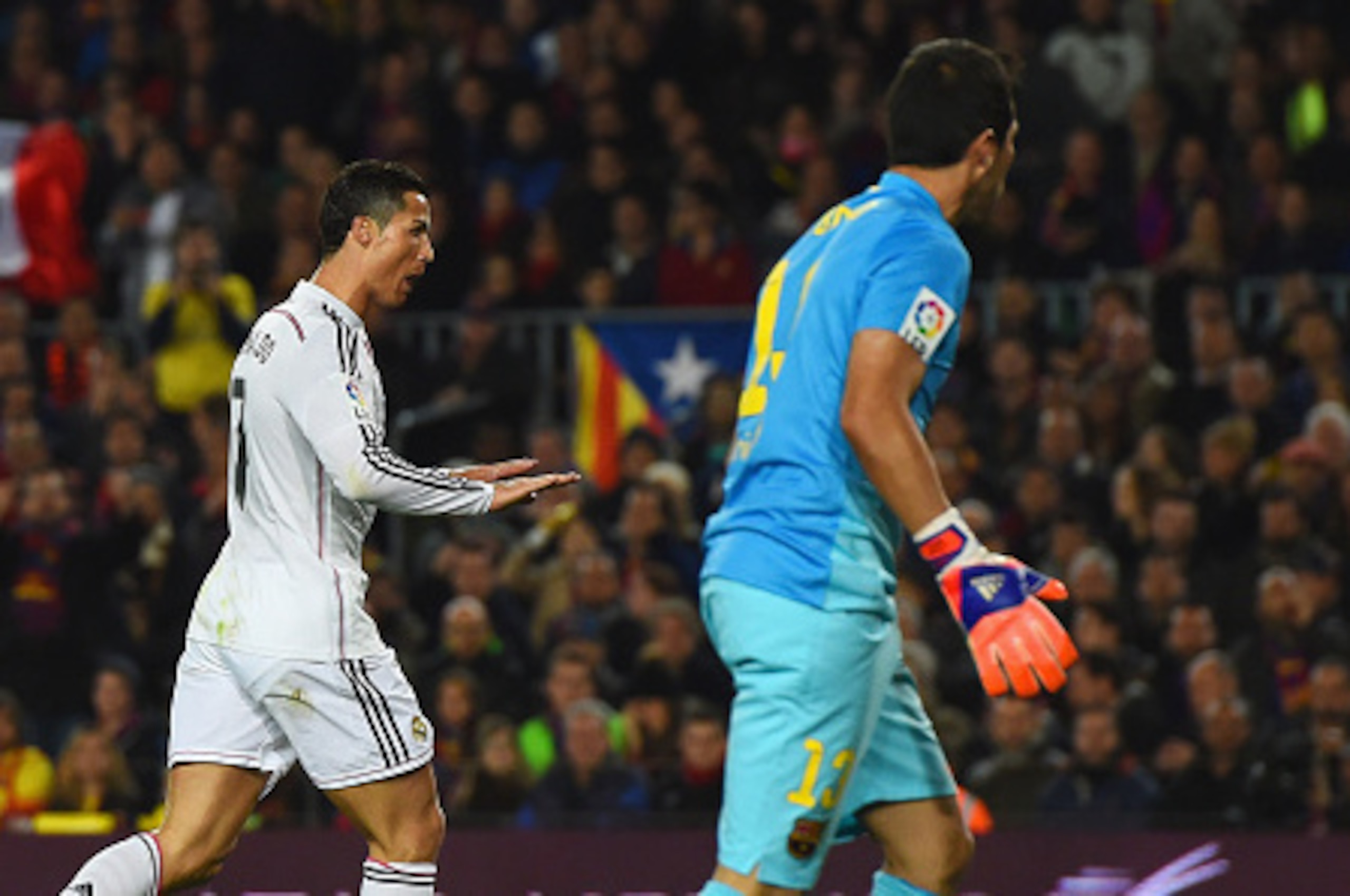 BARCELONA, SPAIN - MARCH 22:  Claudio Bravo of Barcelona looks on as Cristiano Ronaldo of Real Madrid CF celebrates as he scores their first and equalising goal during the La Liga match between FC Barcelona and Real Madrid CF at Camp Nou on March 22, 2015