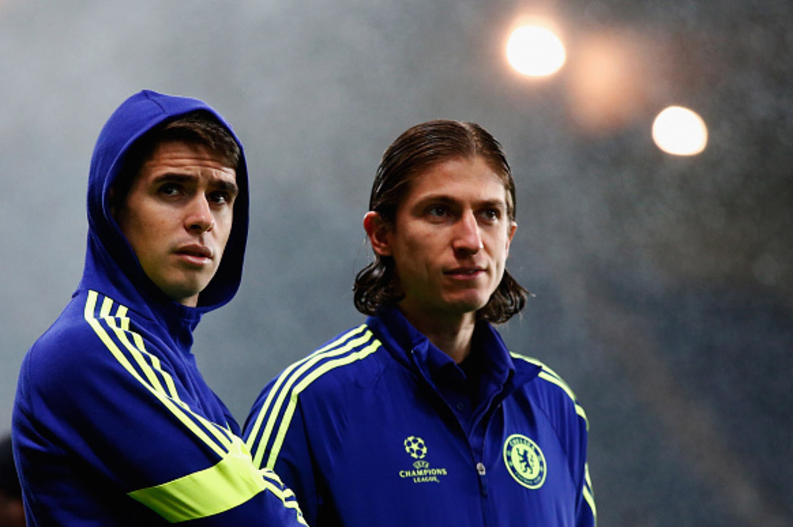 PARIS, FRANCE - FEBRUARY 17:  Oscar (L) and Filipe Luis of Chelsea look on prior to the UEFA Champions League Round of 16 match between Paris Saint-Germain and Chelsea at Parc des Princes on February 17, 2015 in Paris, France.  (Photo by Clive Rose/Getty 