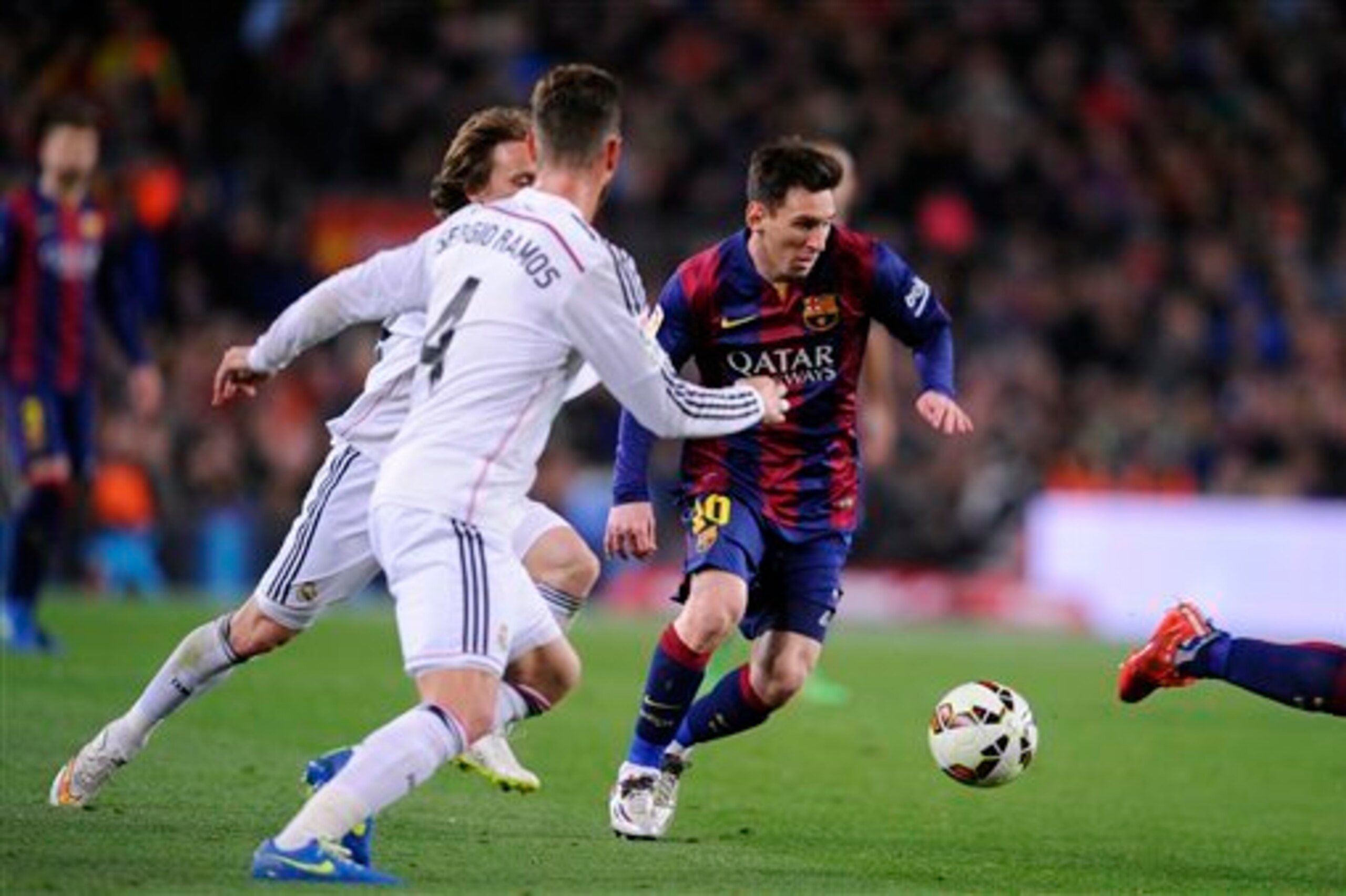 Ramos and Modric chase Messi.