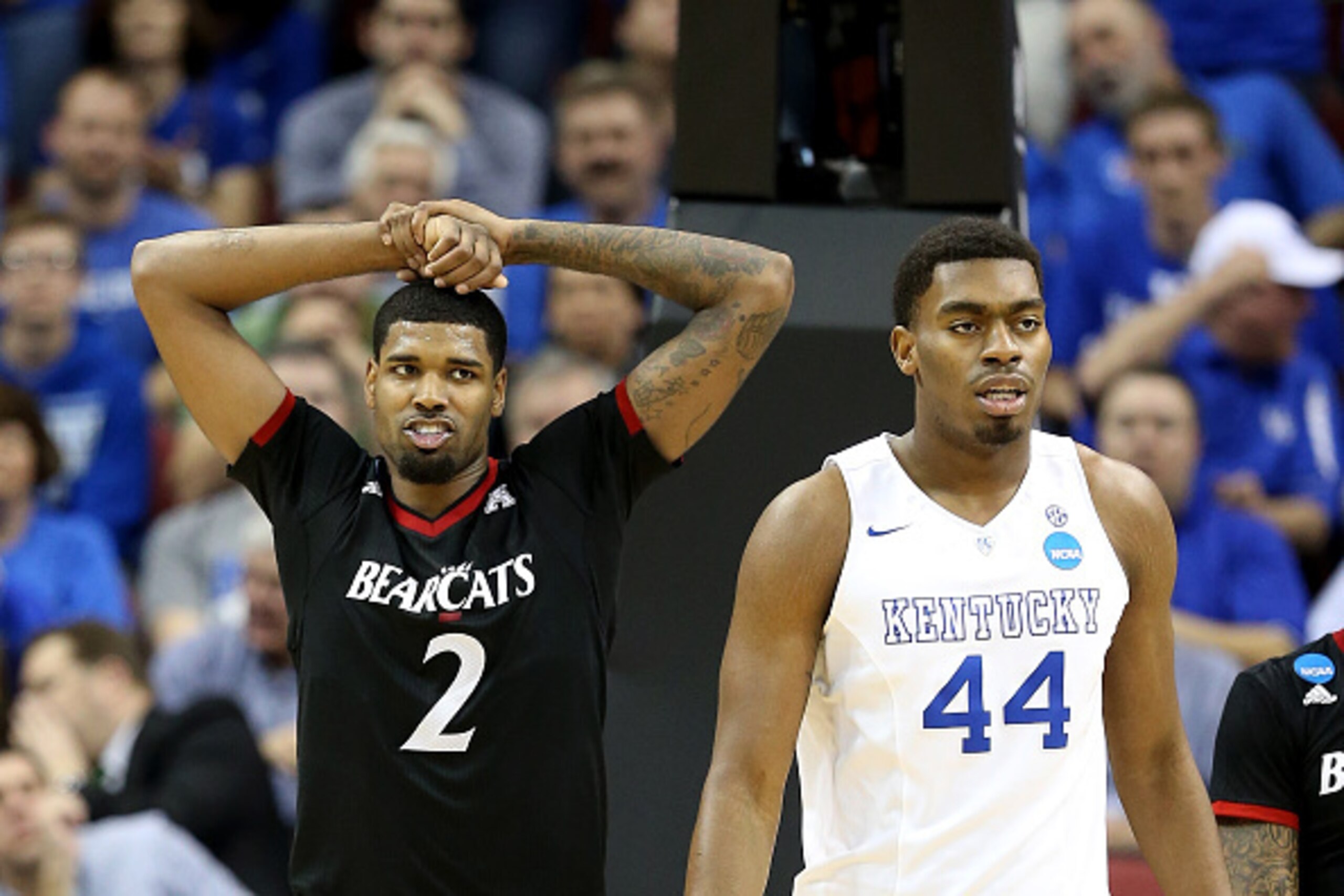 LOUISVILLE, KY - MARCH 21:  Octavius Ellis #2 of the Cincinnati Bearcats reacts as Dakari Johnson #44 of the Kentucky Wildcats watches on during the third round of the 2015 NCAA Men's Basketball Tournament at KFC YUM! Center on March 21, 2015 in Louisvill