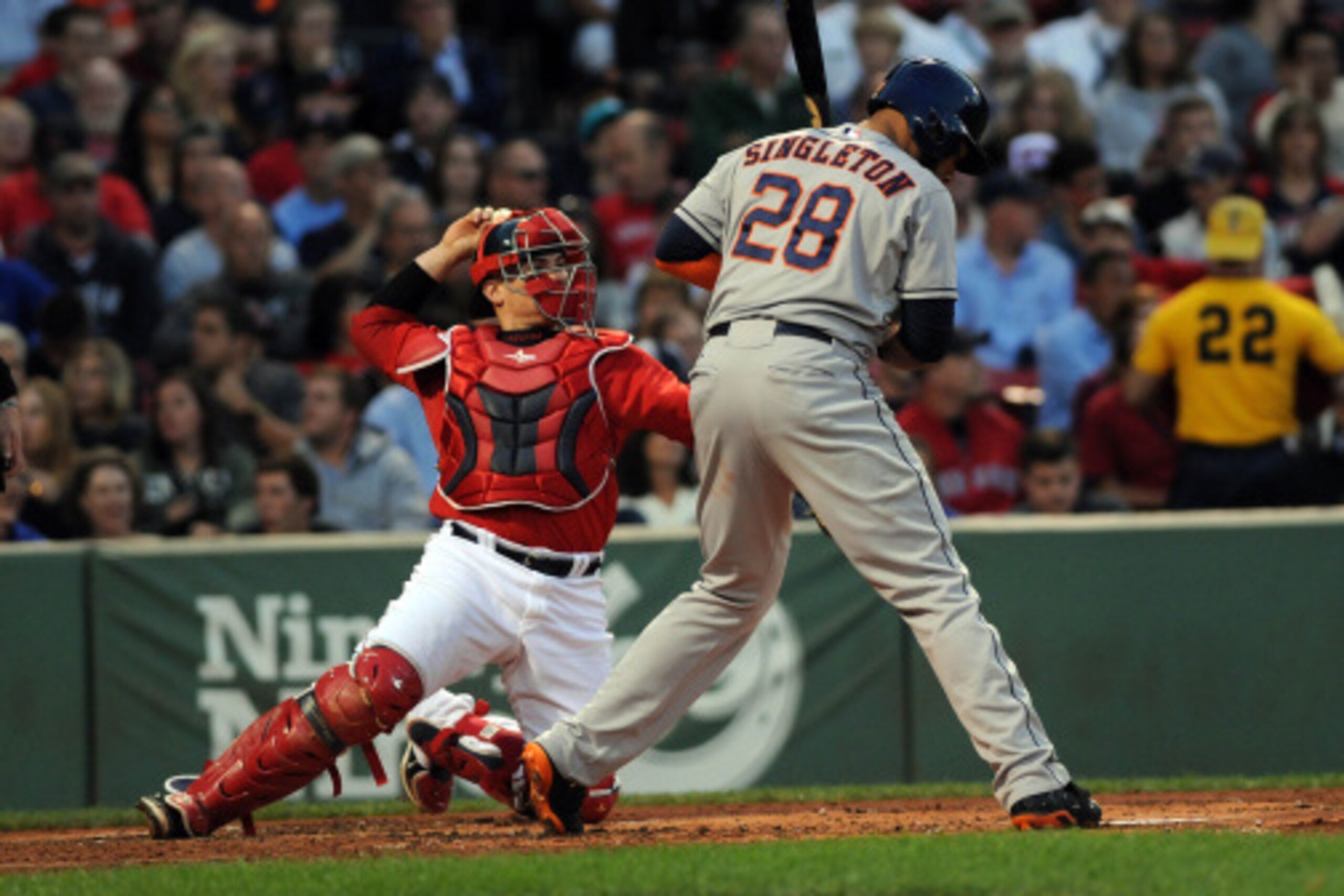 BOSTON, MA - AUGUST 15: Christian Vasquez #55 of the Boston Red Sox throws a pitch back to the mound during the first inning against the Houston Astros at Fenway Park on August 15, 2014 in Boston, Massachusetts. (Photo by Darren McCollester/Getty Images)