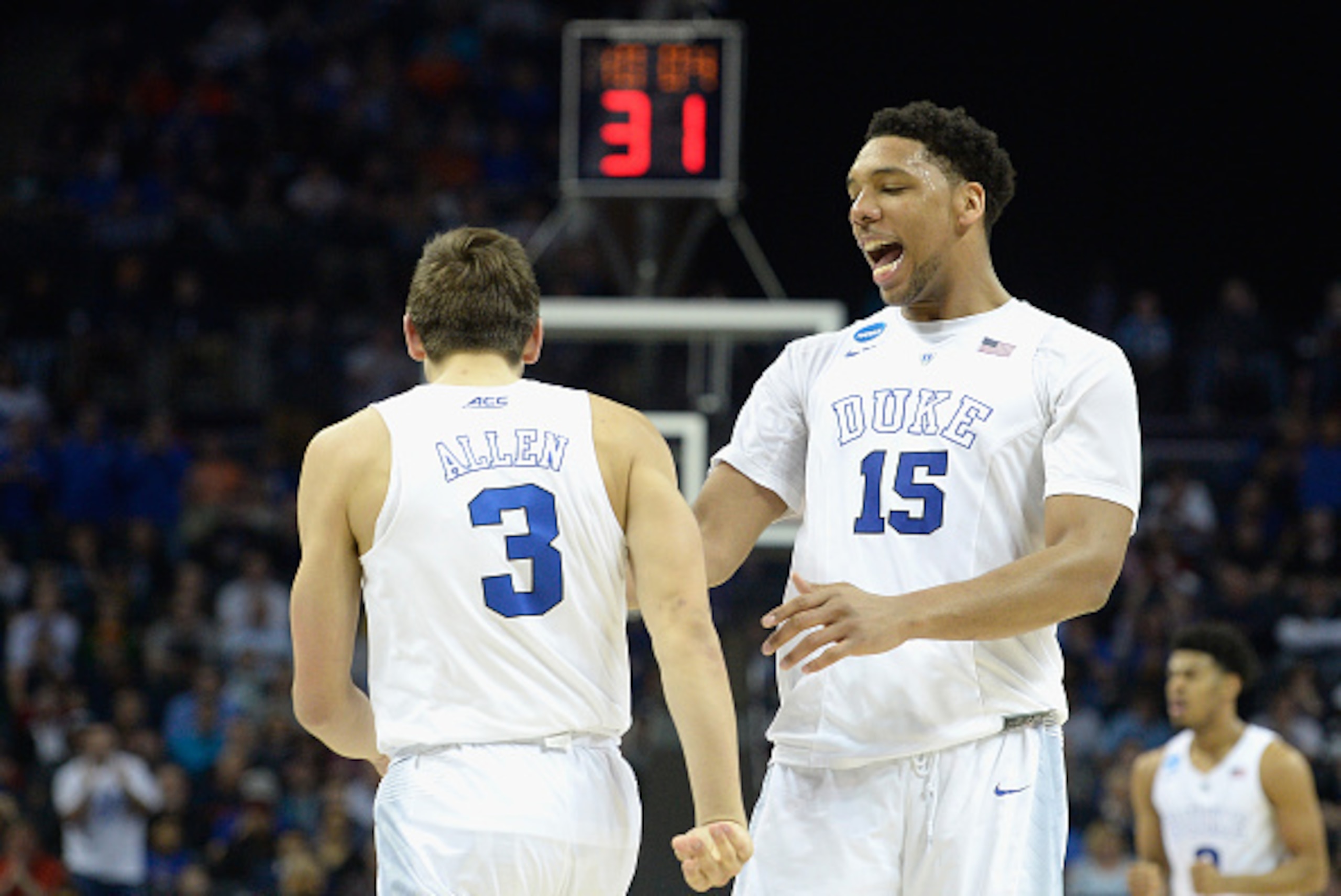 CHARLOTTE, NC - MARCH 22:  Teammates Grayson Allen #3 and Jahlil Okafor #15 of the Duke Blue Devils react against the San Diego State Aztecs during the third round of the 2015 NCAA Men's Basketball Tournament at Time Warner Cable Arena on March 22, 2015 i