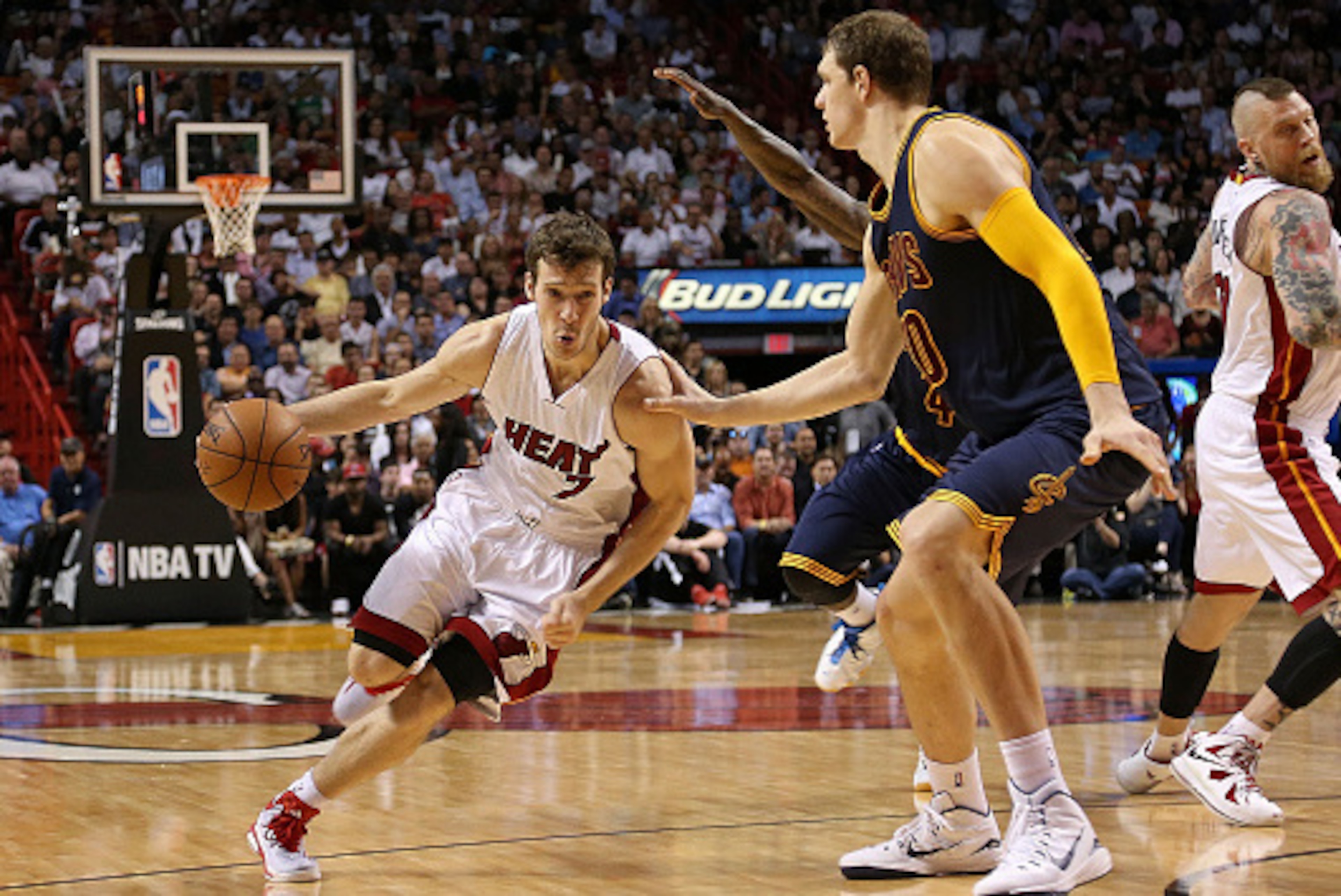 MIAMI, FL - MARCH 16: Goran Dragic #7 of the Miami Heat drives on Timofey Mozgov #20 of the Cleveland Cavaliers during a game at American Airlines Arena on March 16, 2015 in Miami, Florida. NOTE TO USER: User expressly acknowledges and agrees that, by do MIAMI, FL - MARCH 16: Goran Dragic #7 of the Miami Heat drives on Timofey Mozgov #20 of the Cleveland Cavaliers during a game at American Airlines Arena on March 16, 2015 in Miami, Florida. NOTE TO USER: User expressly acknowledges and agrees that, by do