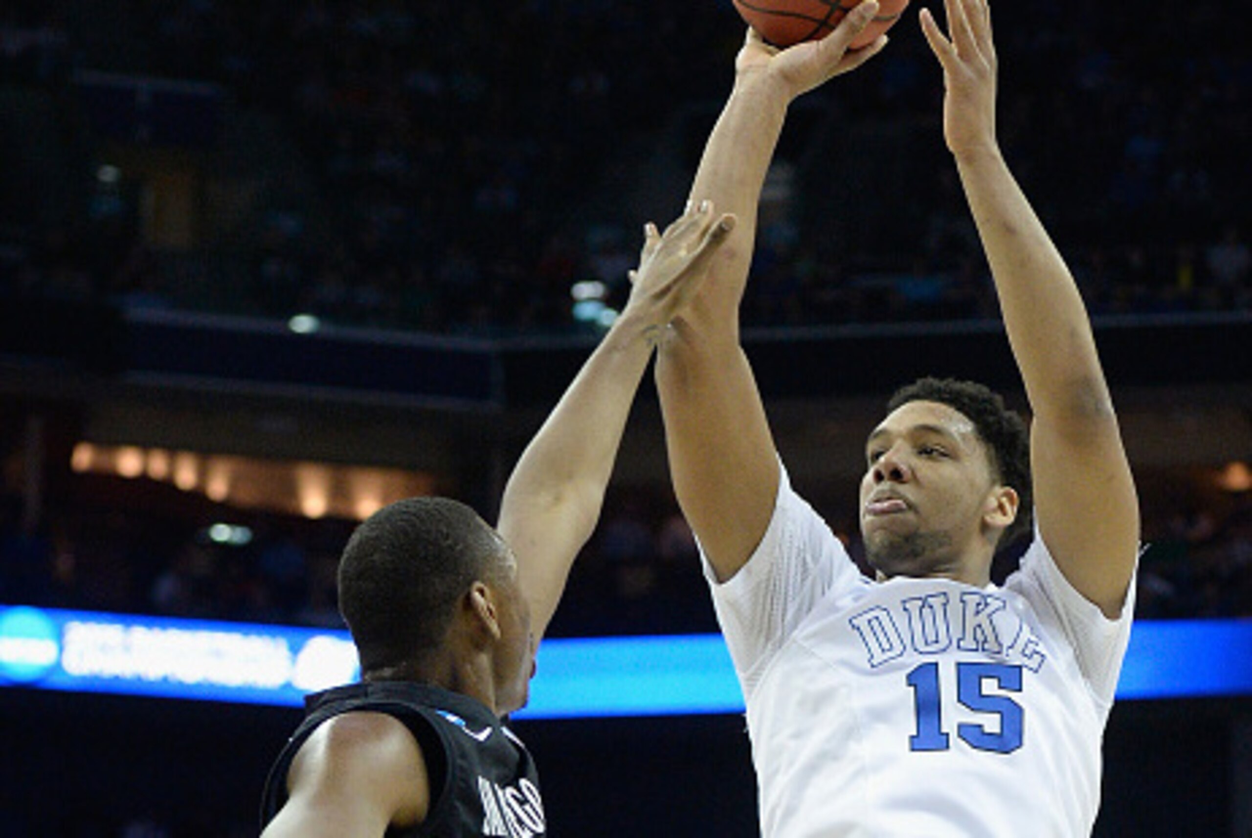 CHARLOTTE, NC - MARCH 22:  Jahlil Okafor #15 of the Duke Blue Devils shoots over Skylar Spencer #0 of the San Diego State Aztecs during the third round of the 2015 NCAA Men's Basketball Tournament at Time Warner Cable Arena on March 22, 2015 in Charlotte,