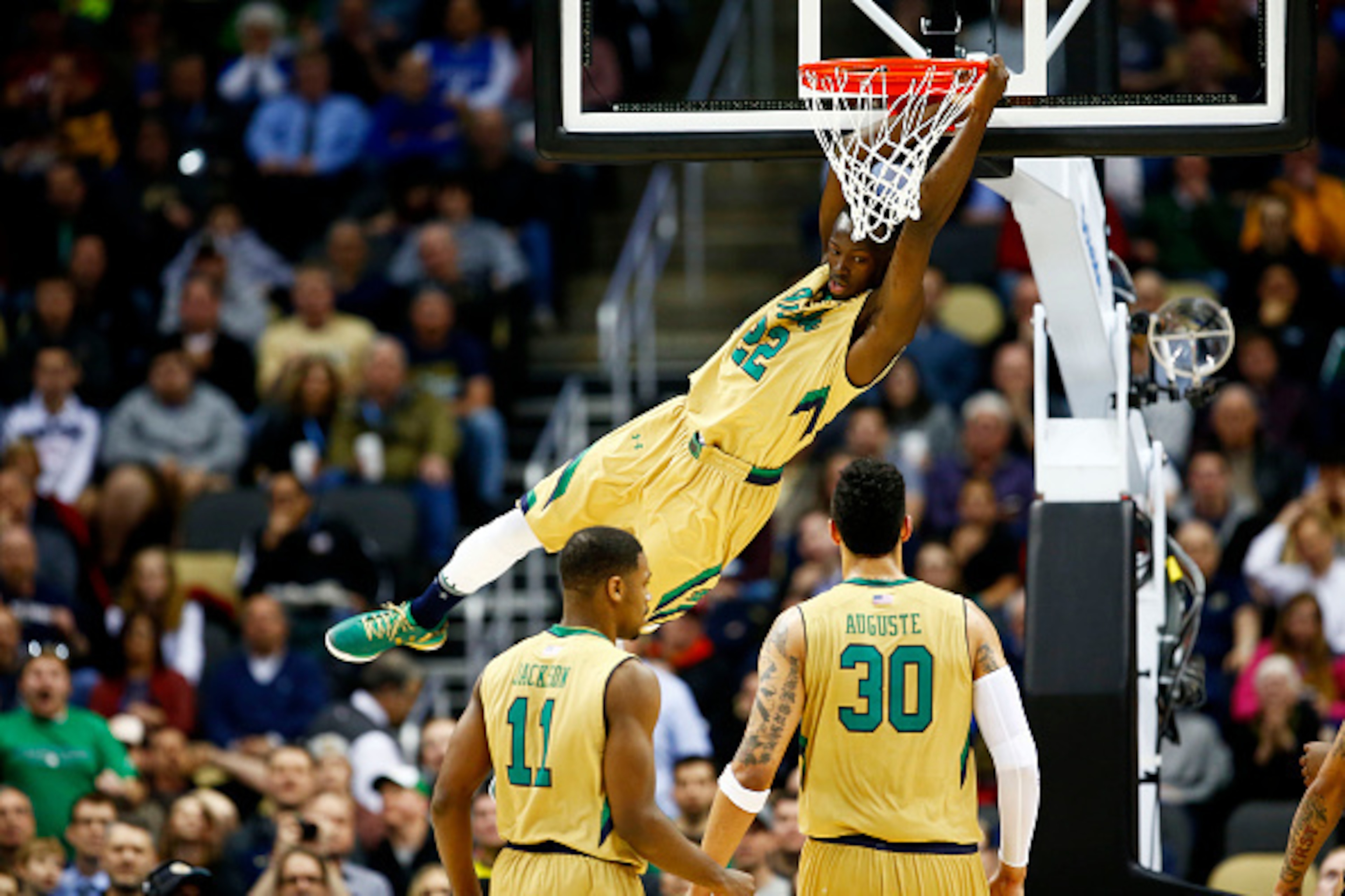PITTSBURGH, PA - MARCH 19:  Jerian Grant #22 of the Notre Dame Fighting Irish dunks against the Northeastern Huskies in the second half during the second round of the 2015 NCAA Men's Basketball Tournament at Consol Energy Center on March 19, 2015 in Pitts