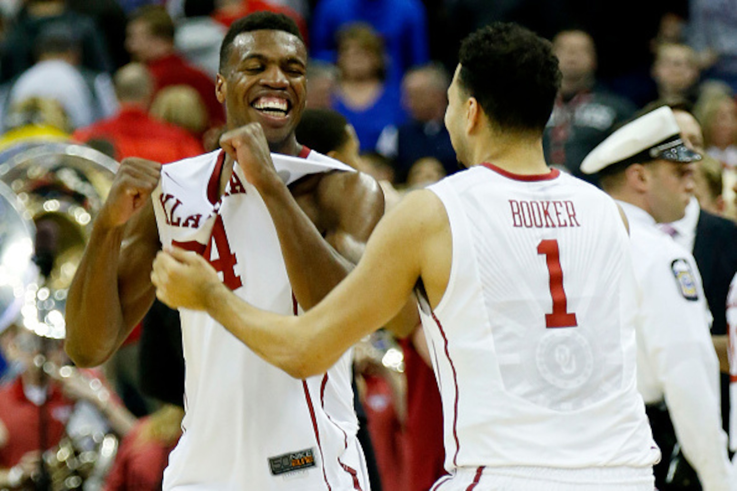 COLUMBUS, OH - MARCH 22:  Buddy Hield #24 and Frank Booker #1 of the Oklahoma Sooners celebrate their 72 to 66 win over the Dayton Flyers during the third round of the 2015 NCAA Men's Basketball Tournament at Nationwide Arena on March 22, 2015 in Columbus
