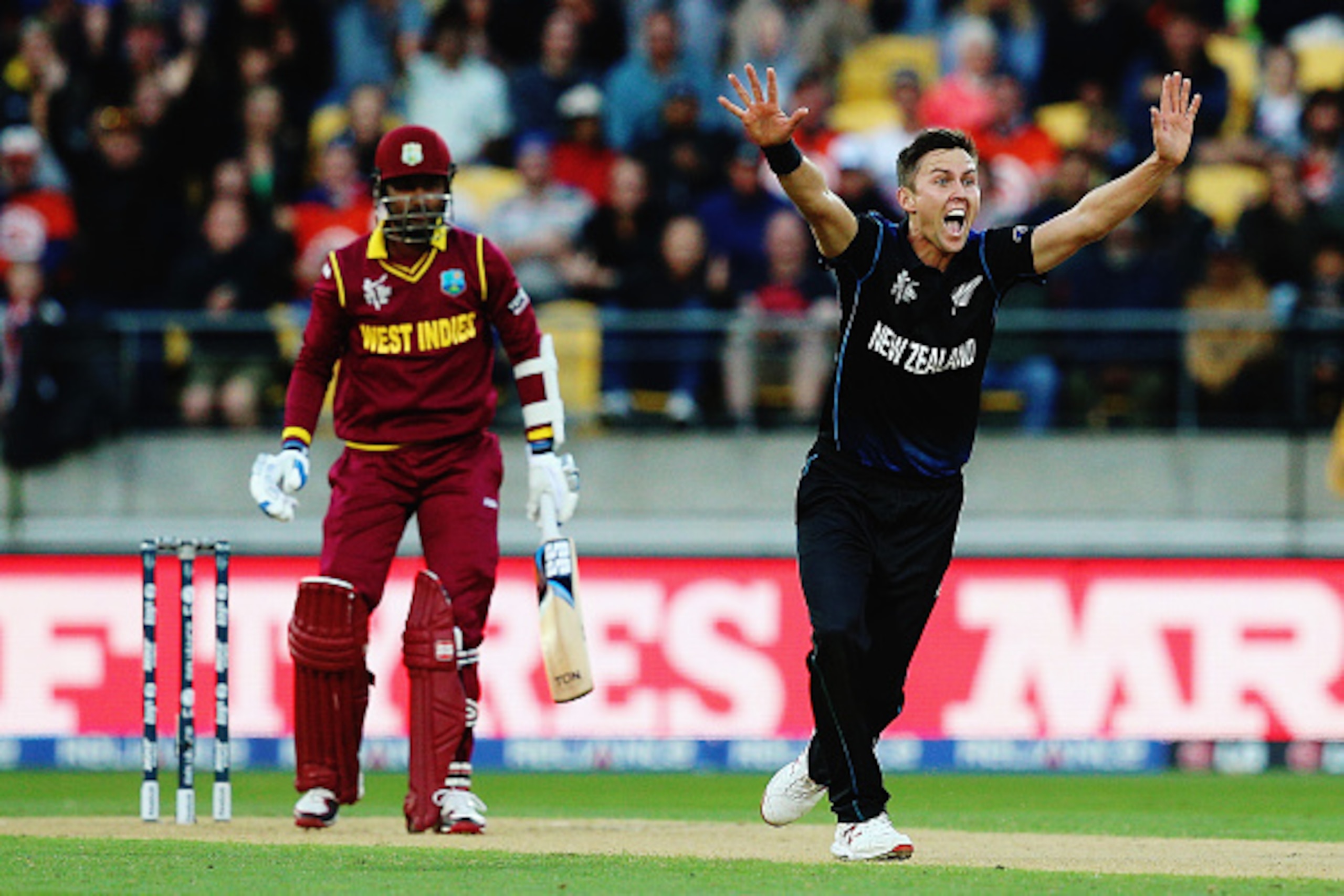 WELLINGTON, NEW ZEALAND - MARCH 21:  Trent Boult of New Zealand celebrates after claiming the wicket of Denesh Ramdin of West Indies during the 2015 ICC Cricket World Cup match between New Zealand and the West Indies at Wellington Regional Stadium on Marc