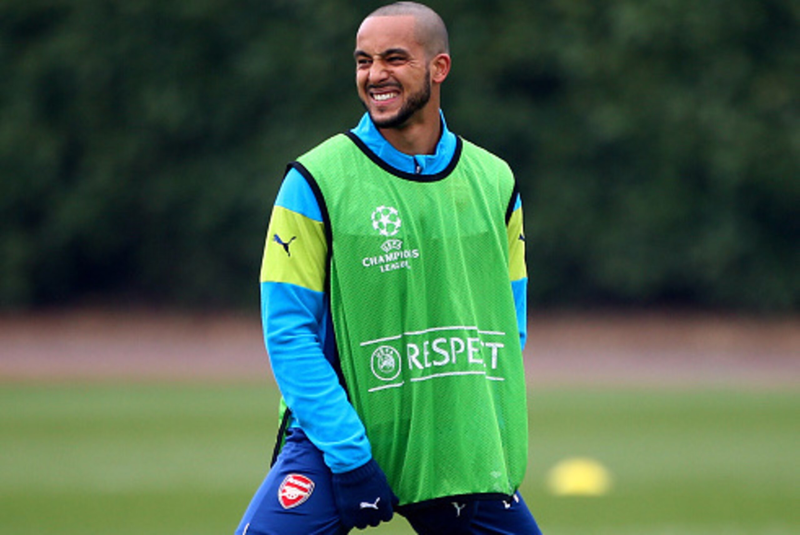ST ALBANS, ENGLAND - MARCH 16: Arsenal's Theo Walcott warms up during the Arsenal Training Session ahead of their Champions League match against AS Monaco on March 16, 2015 in St Albans, England. (Photo by Charlie Crowhurst/Getty Images)