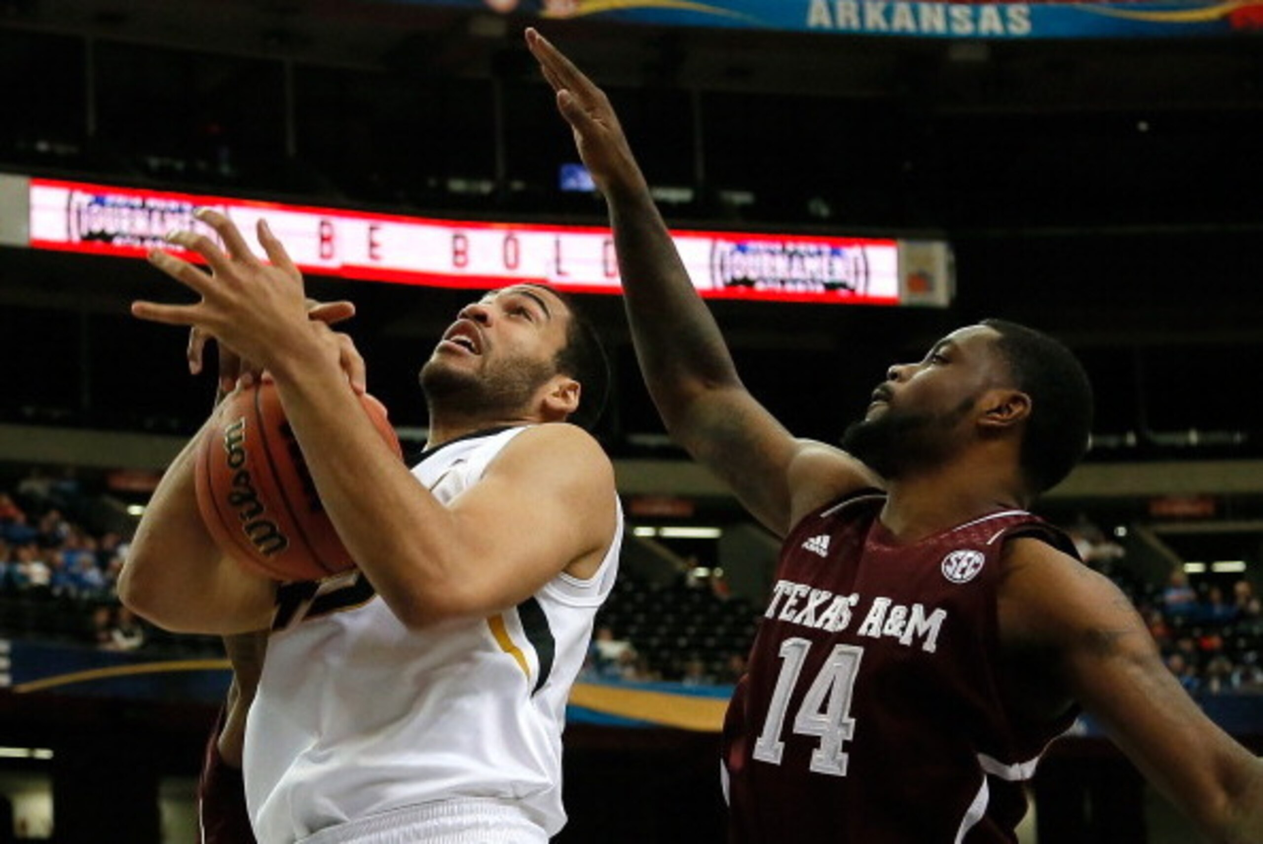ATLANTA, GA - MARCH 13:  Keanau Post #45 of the Missouri Tigers battles for a rebound against Kourtney Roberson #14 and Jamal Jones #23 of the Texas A&M Aggies during the second round of the SEC Men's Basketball Tournament at Georgia Dome on March 13, 201