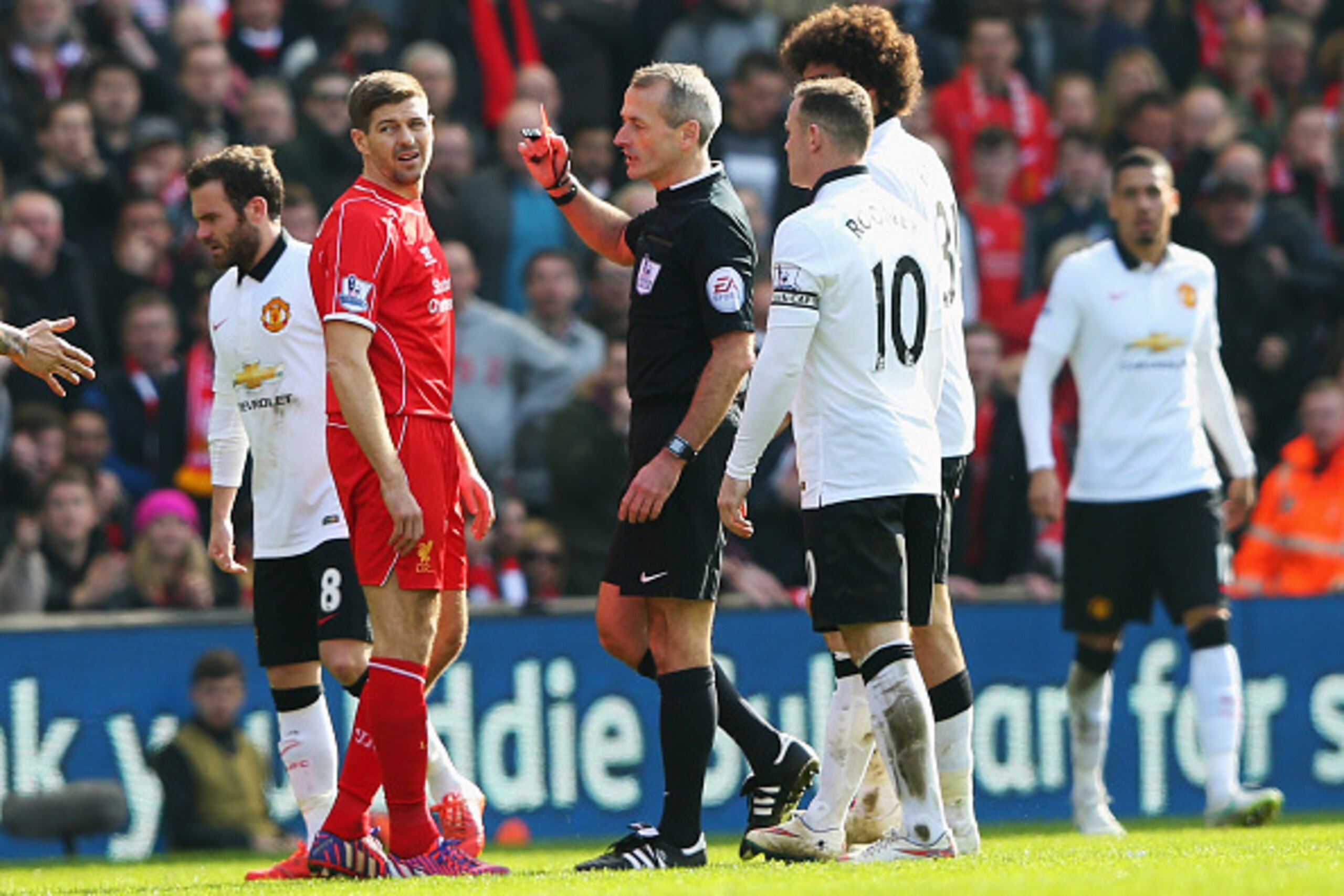 LIVERPOOL, ENGLAND - MARCH 22: Steven Gerrard of Liverpool is shown the red card by referee Martin Atkinson during the Barclays Premier League match between Liverpool and Manchester United at Anfield on March 22, 2015 in Liverpool, England.  (Photo by Ale