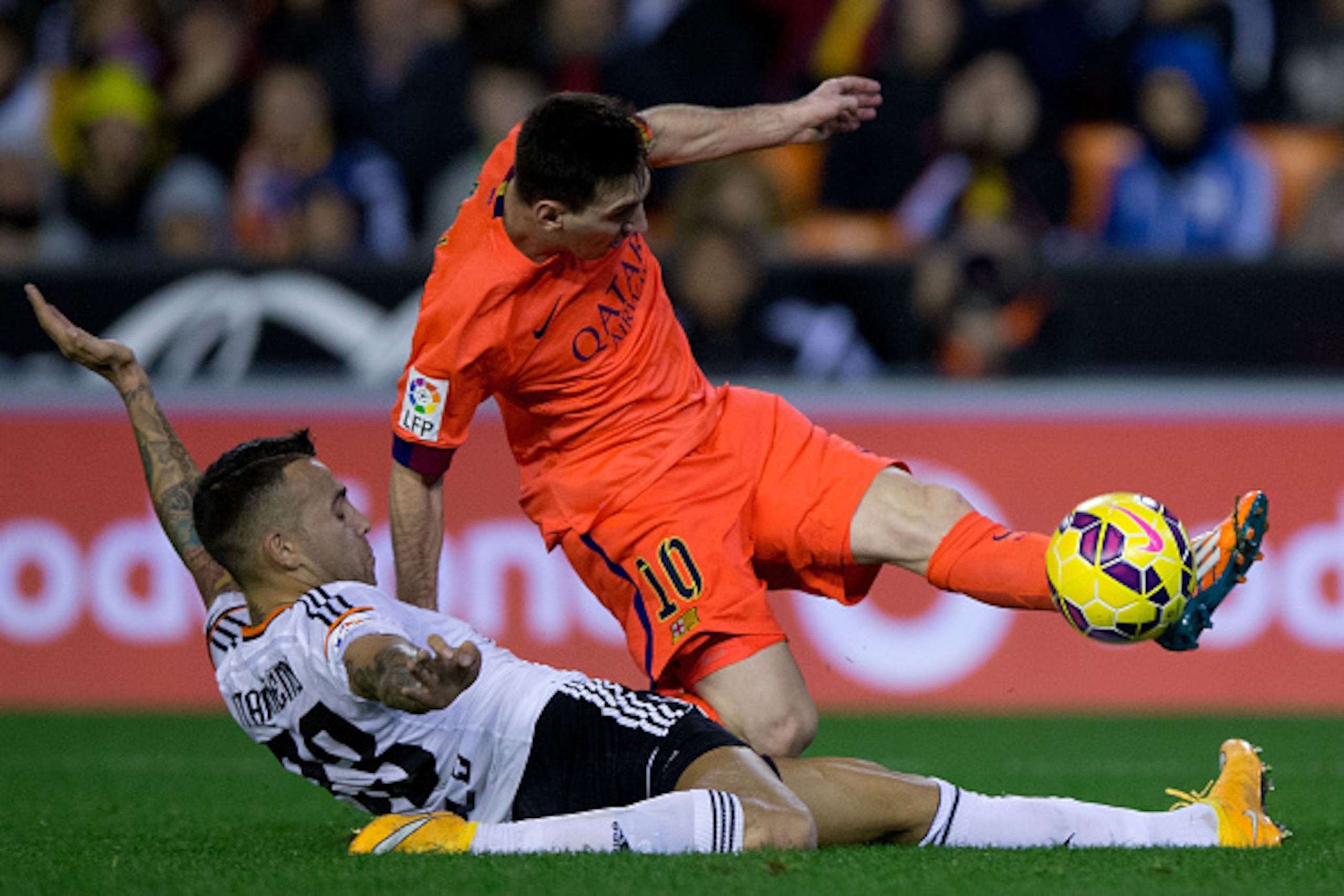 VALENCIA, SPAIN - NOVEMBER 30: Lionel Messi (R) of FC Barcelona is tackled by Nicolas Otamendi (L) of Valencia CF during the La Liga match between Valencia CF and FC Barcelona at Estadi de Mestalla on November 30, 2014 in Valencia, Spain. (Photo by Gon VALENCIA, SPAIN - NOVEMBER 30: Lionel Messi (R) of FC Barcelona is tackled by Nicolas Otamendi (L) of Valencia CF during the La Liga match between Valencia CF and FC Barcelona at Estadi de Mestalla on November 30, 2014 in Valencia, Spain. (Photo by Gon