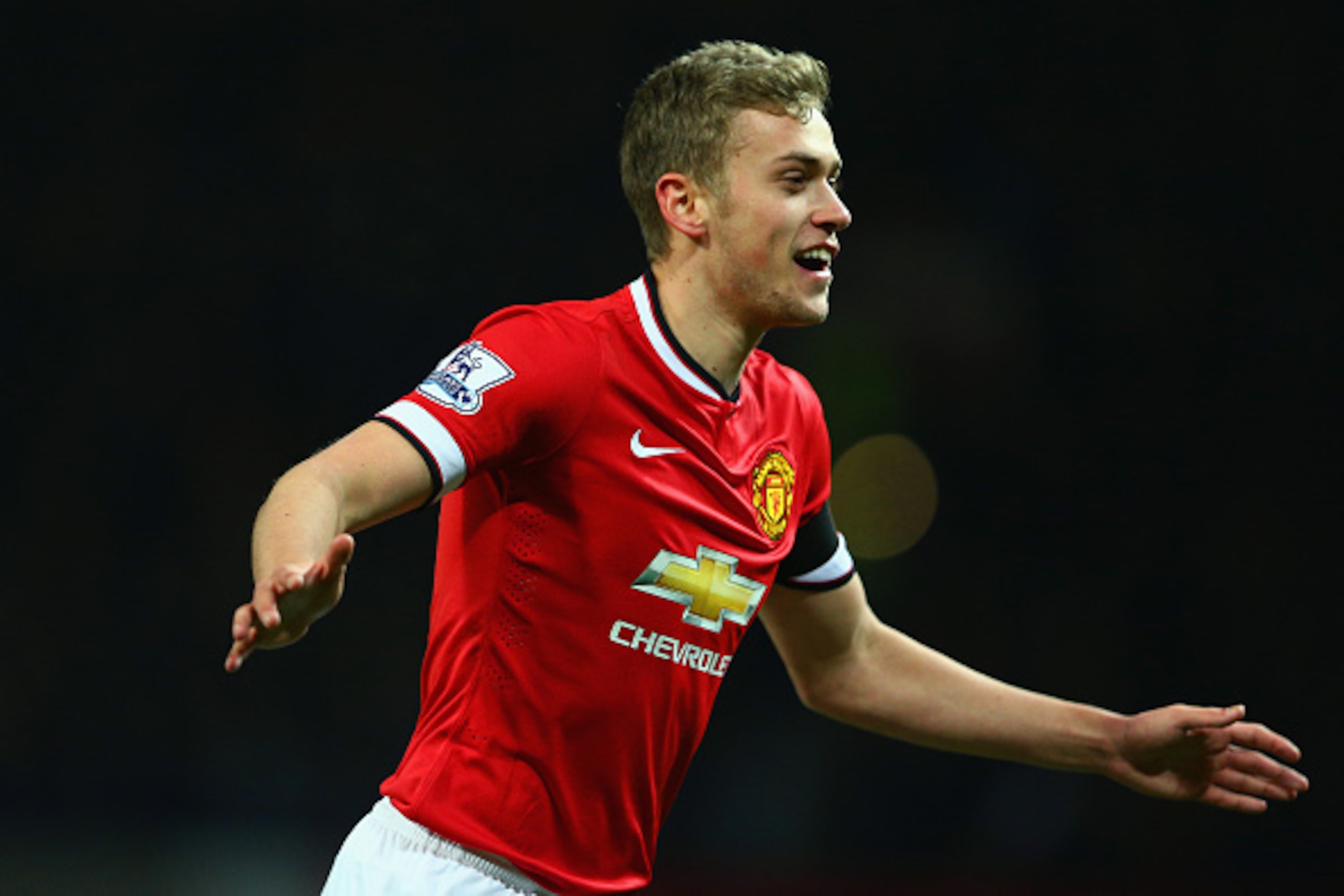 MANCHESTER, ENGLAND - FEBRUARY 03: James Wilson of Manchester United celebrates scoring their third goal during the FA Cup Fourth round replay match between Manchester United and Cambridge United at Old Trafford on February 3, 2015 in Manchester, England MANCHESTER, ENGLAND - FEBRUARY 03: James Wilson of Manchester United celebrates scoring their third goal during the FA Cup Fourth round replay match between Manchester United and Cambridge United at Old Trafford on February 3, 2015 in Manchester, England
