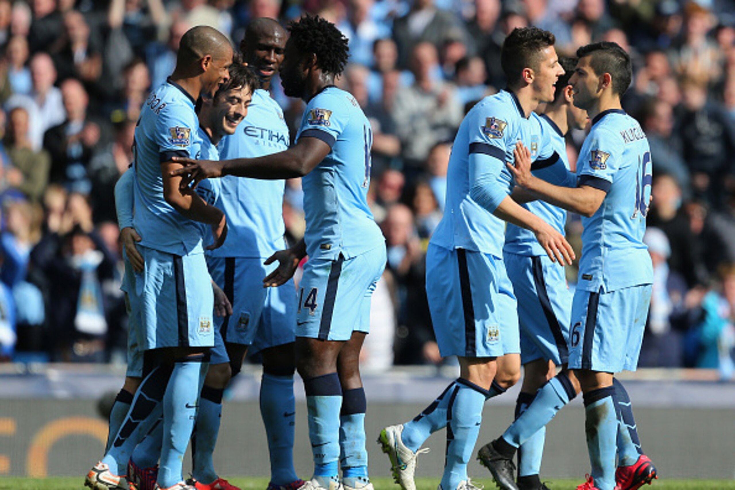 MANCHESTER, ENGLAND - MARCH 21:  David Silva of Manchester City (2L) celebrates scoring their third goal with team mates during the Barclays Premier League match between Manchester City and West Bromwich Albion at Etihad Stadium on March 21, 2015 in Manch