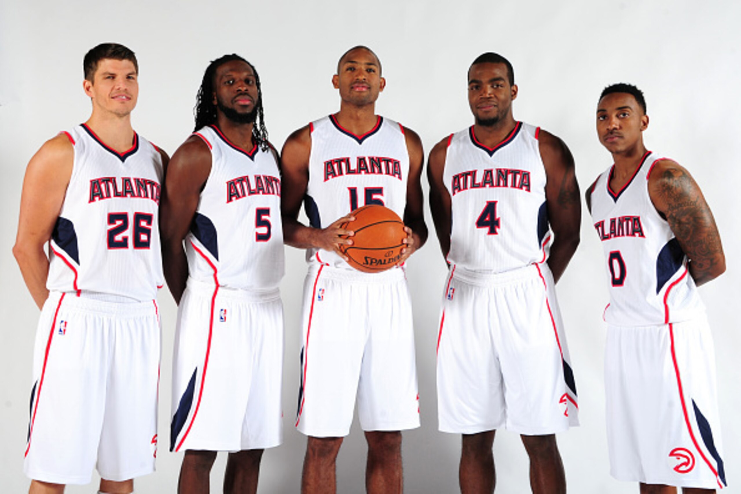 ATLANTA, GA - SEPTEMBER 29: Kyle Korver #26, DeMarre Carroll #5, Al Horford #15, Paul Millsap #4, and Jeff Teague #0 of the Atlanta Hawks pose for a photograph during the Atlanta Hawks Media Day on September 29, 2014 at Philips Arena in Atlanta, Georgia. 