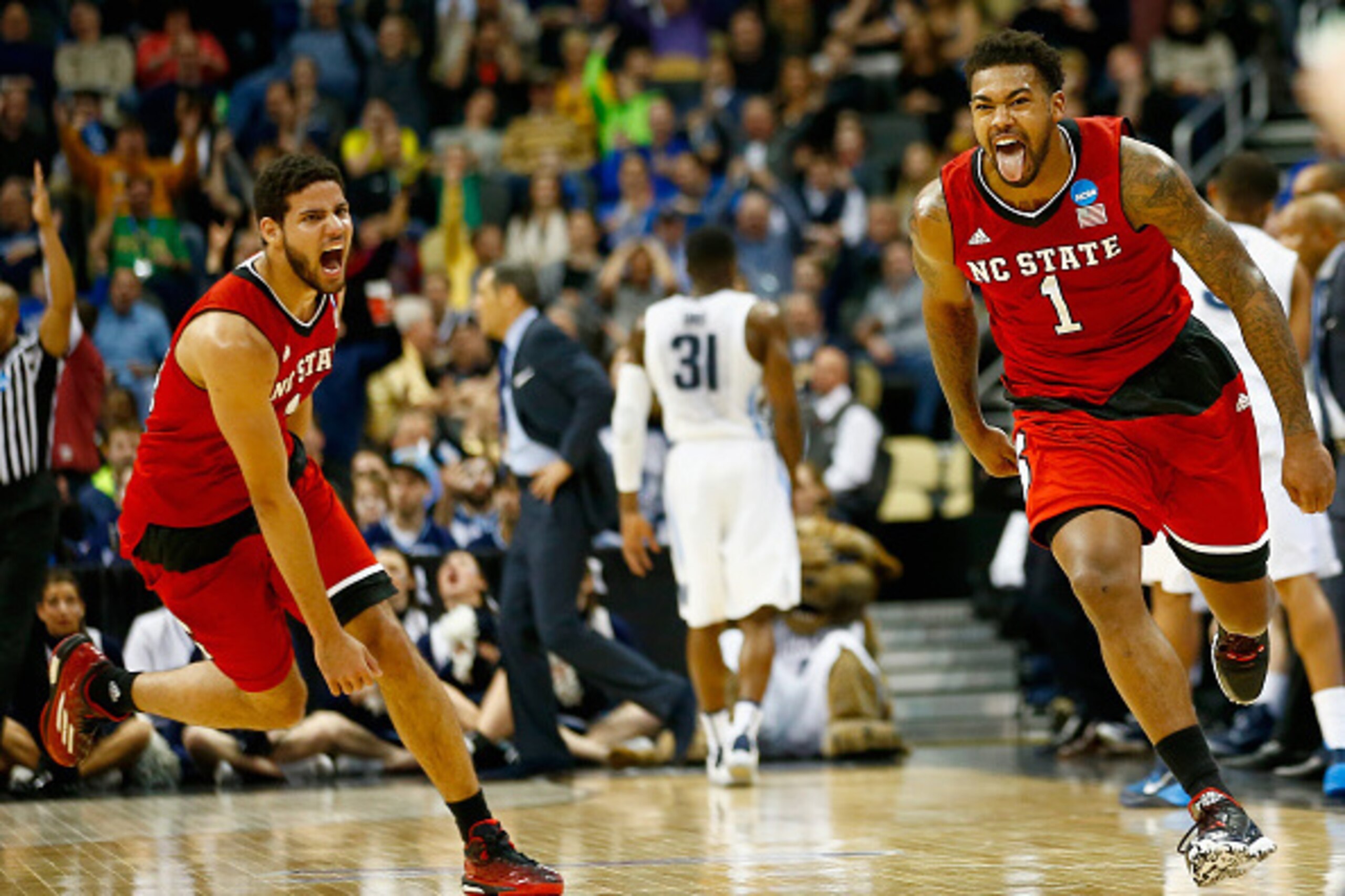 PITTSBURGH, PA - MARCH 21:  Trevor Lacey #1 of the North Carolina State Wolfpack celebrates after hitting a three pointer at the end of the first half against the Villanova Wildcats during the third round of the 2015 NCAA Men's Basketball Tournament at Co