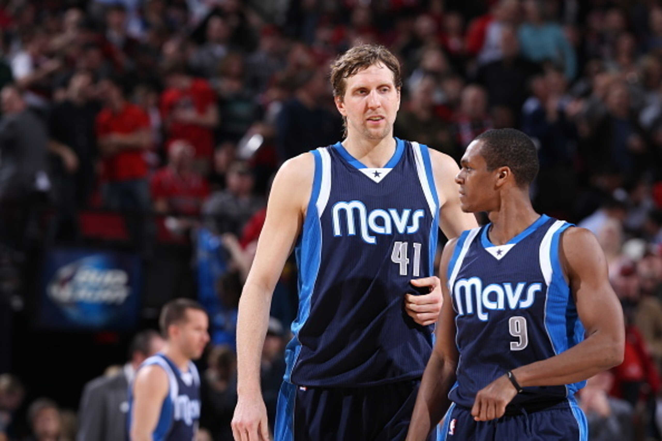PORTLAND, OR - MARCH 5: Dirk Nowitzki #41 and Rajon Rondo #9 of the Dallas Mavericks speak during a game against the Portland Trail Blazers on March 5, 2015 at the Moda Center Arena in Portland, Oregon. NOTE TO USER: User expressly acknowledges and agrees